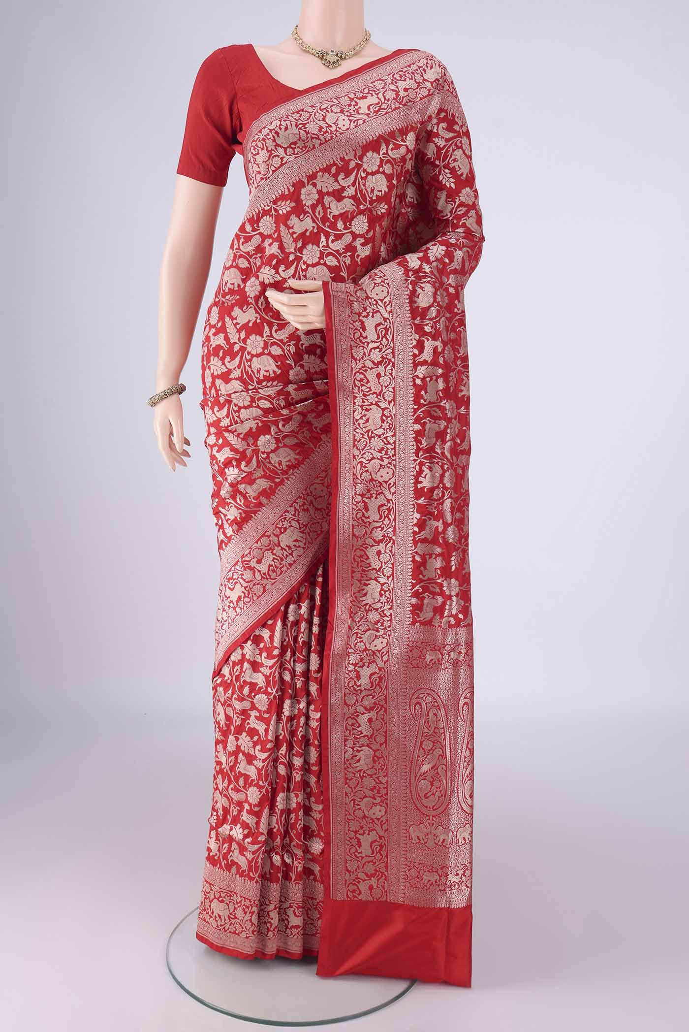 Red Banarasi Silk Saree with Zari Brocade on the body and Zari Border.  displayed on a mannequin
