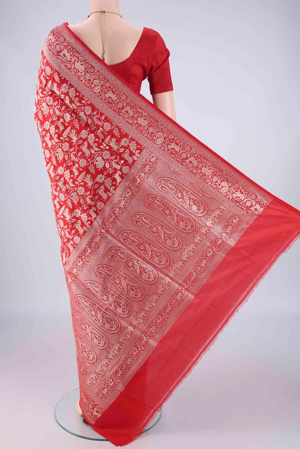 Flat view of Red Banarasi Silk Saree with Zari Brocade on the body and Zari Border. 