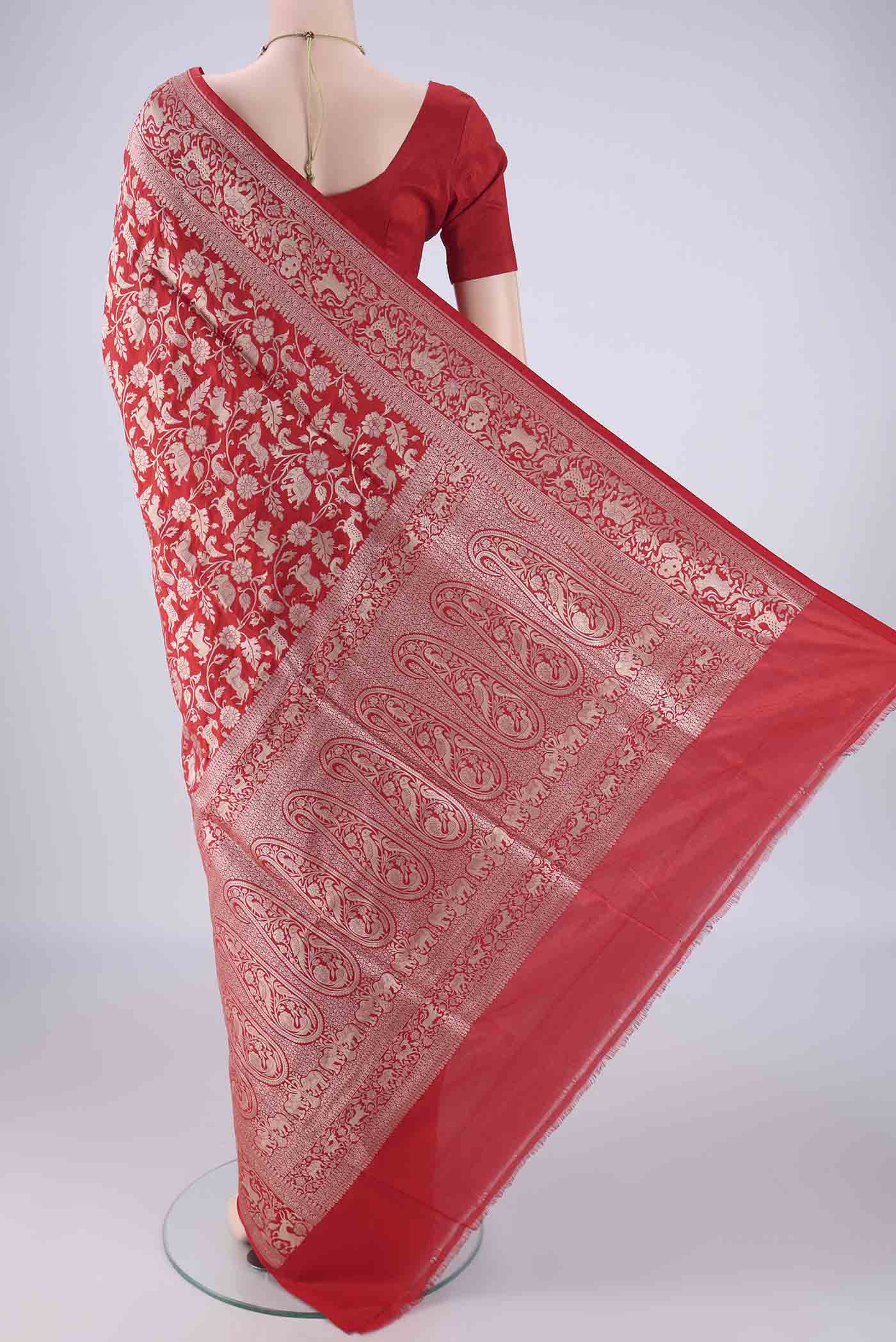 Flat view of Red Banarasi Silk Saree with Zari Brocade on the body and Zari Border. 