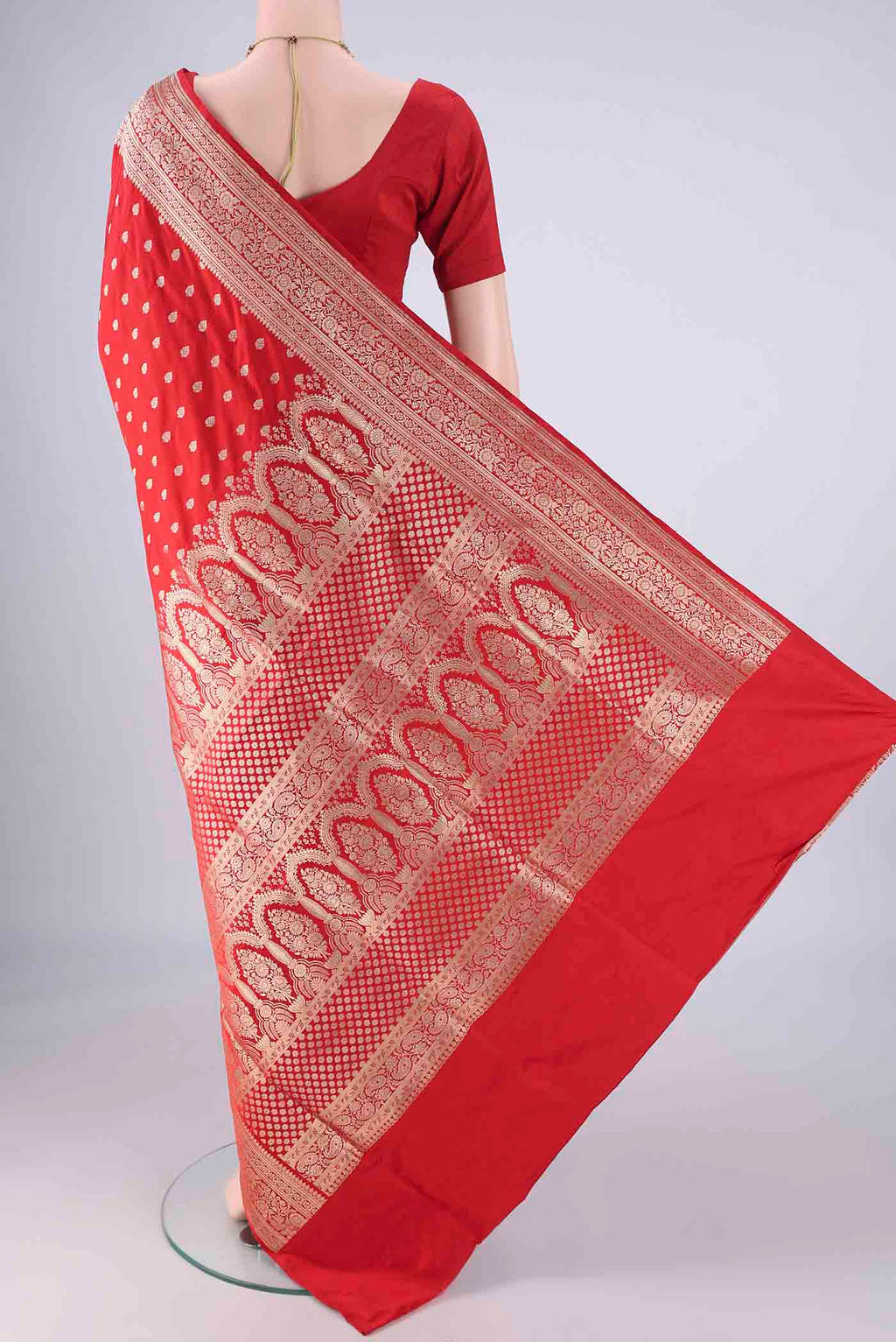 Flat view of Red Banarasi Silk Saree with Zari Butta on the body and Zari Border. 