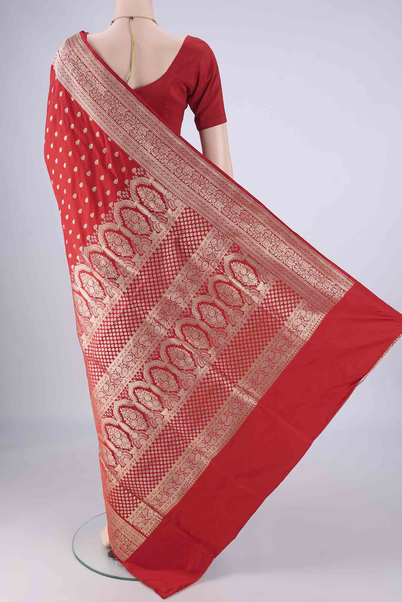Flat view of Red Banarasi Silk Saree with Zari Butta on the body and Zari Border. 