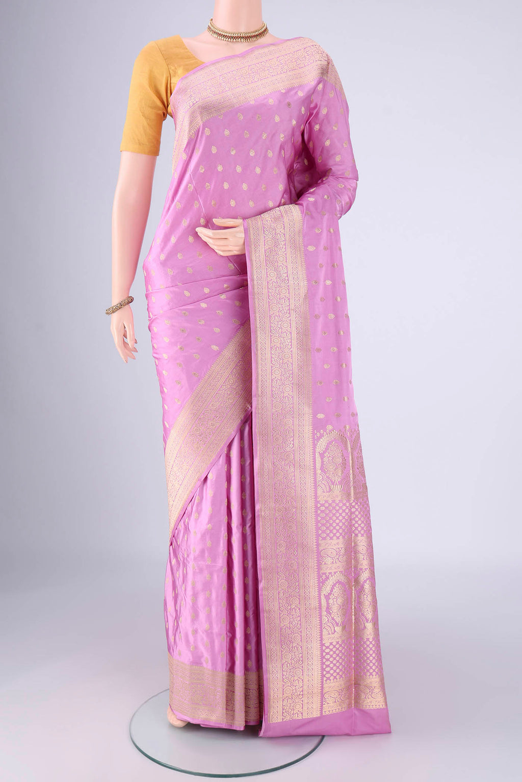 Lilac Banarasi Silk Saree with Zari Butta on the body and Zari Border.  displayed on a mannequin