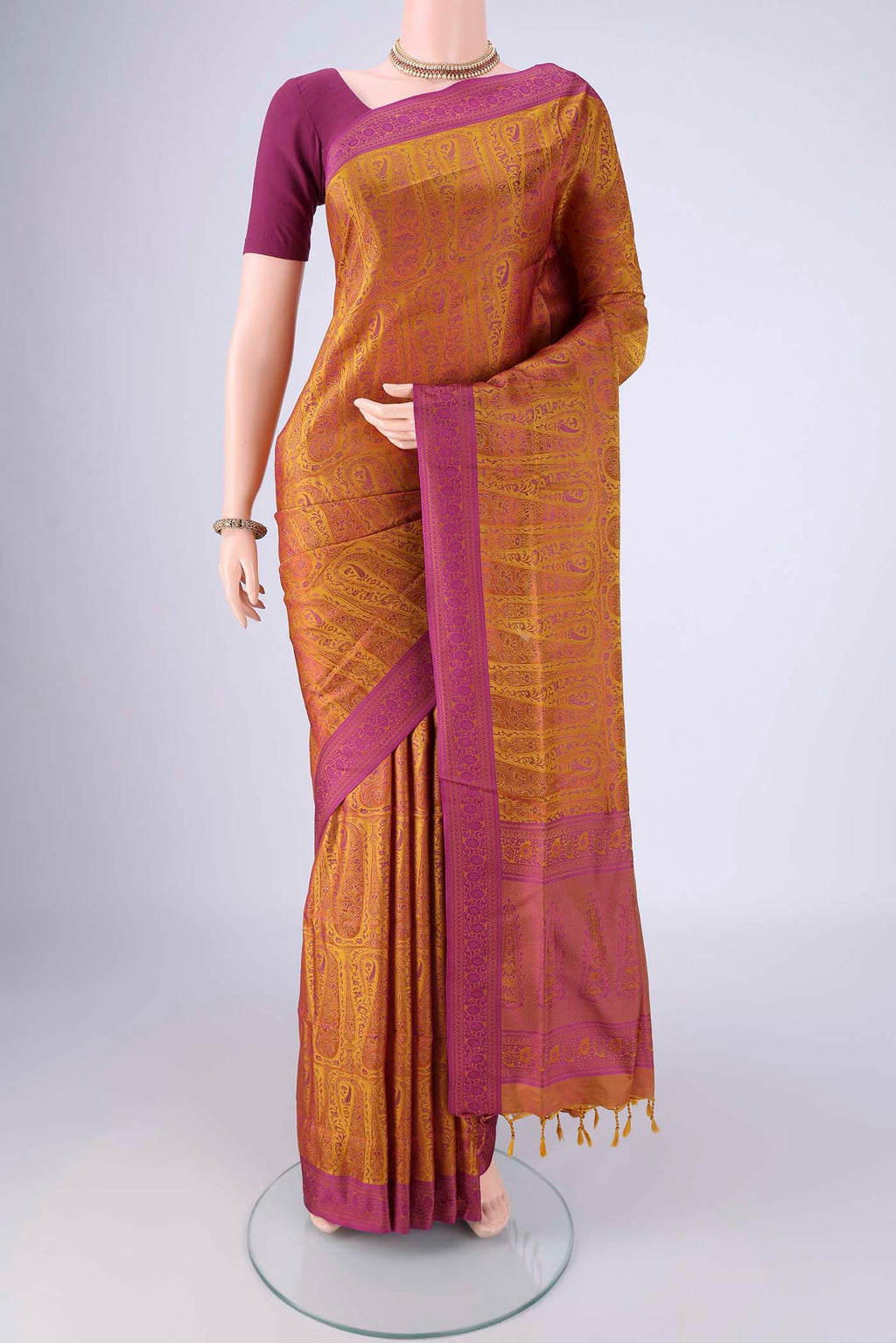 Mustard Soft Silk Saree with Jacquard design on the body and Thread Border.  displayed on a mannequin