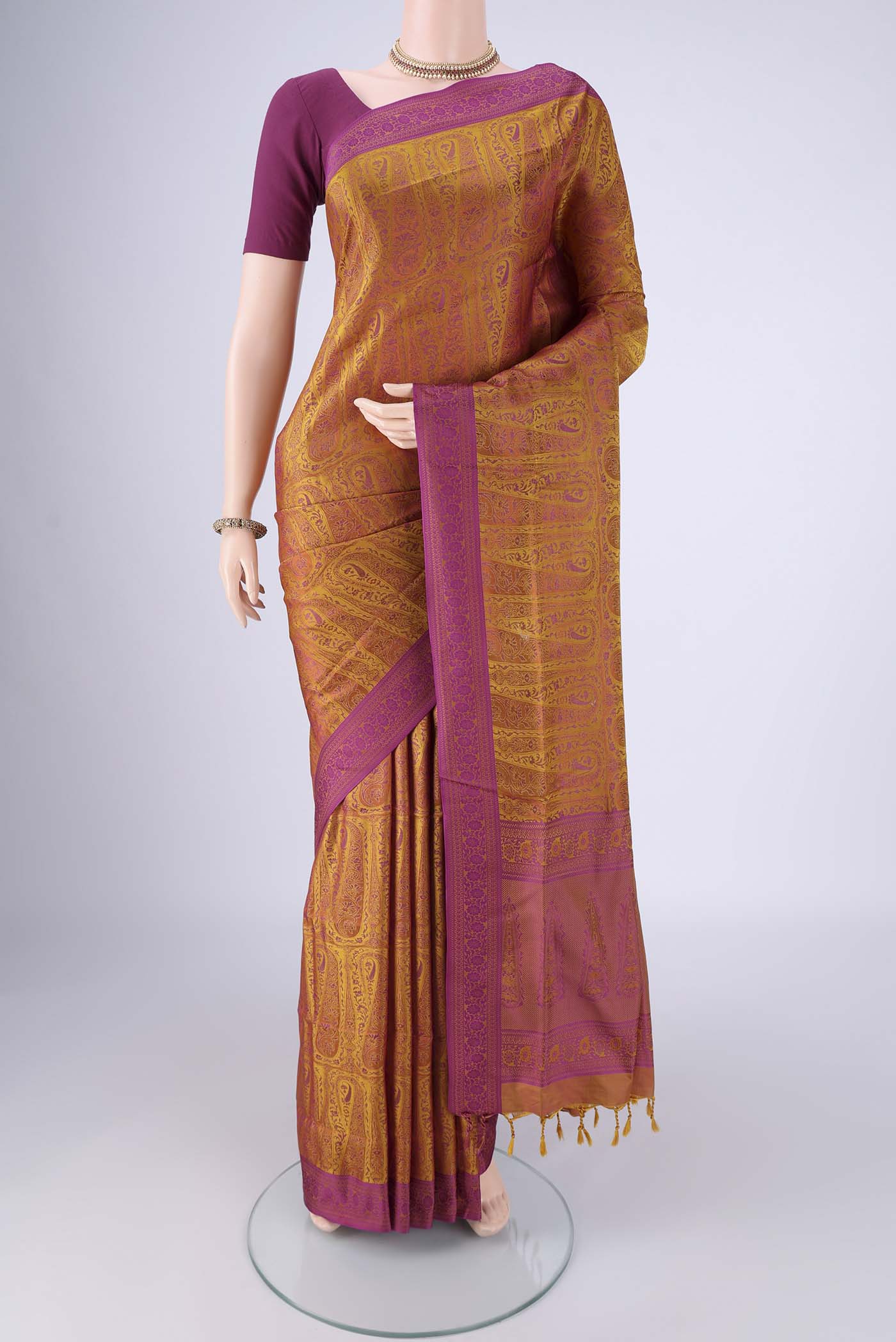 Mustard Soft Silk Saree with Jacquard design on the body and Thread Border.  displayed on a mannequin