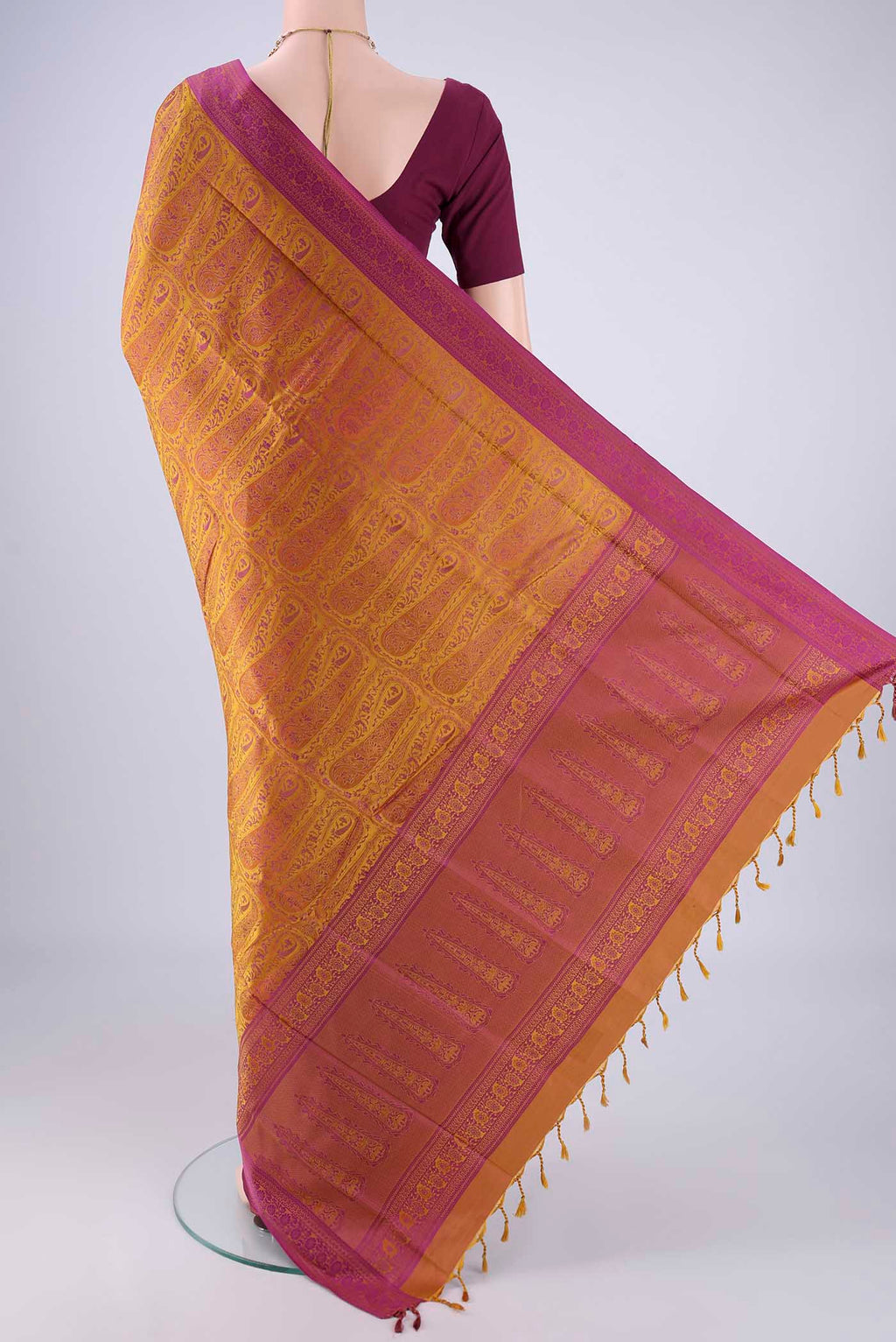 Flat view of Mustard Soft Silk Saree with Jacquard design on the body and Thread Border. 