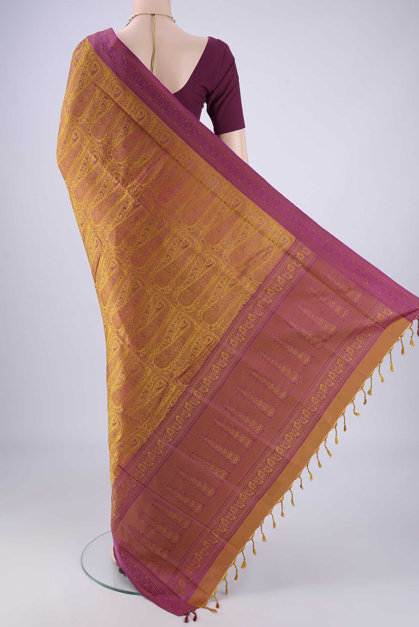 Flat view of Mustard Soft Silk Saree with Jacquard design on the body and Thread Border. 
