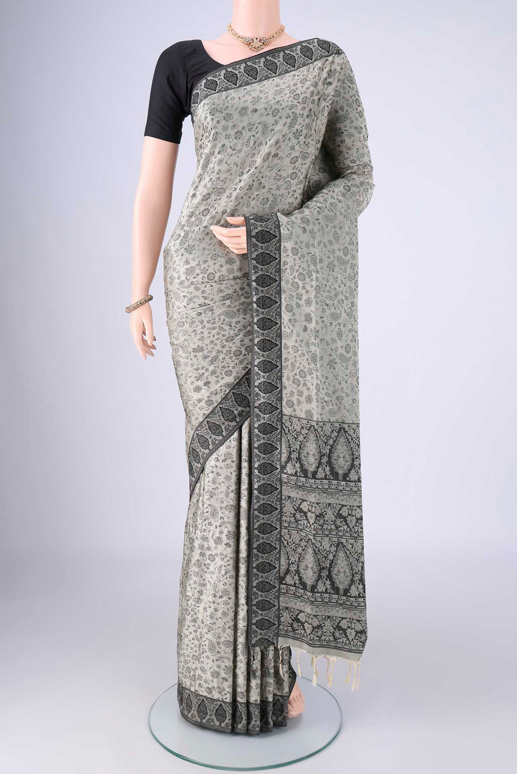 Davys Grey Soft Silk Saree with Jacquard design on the body and Thread Border.  displayed on a mannequin