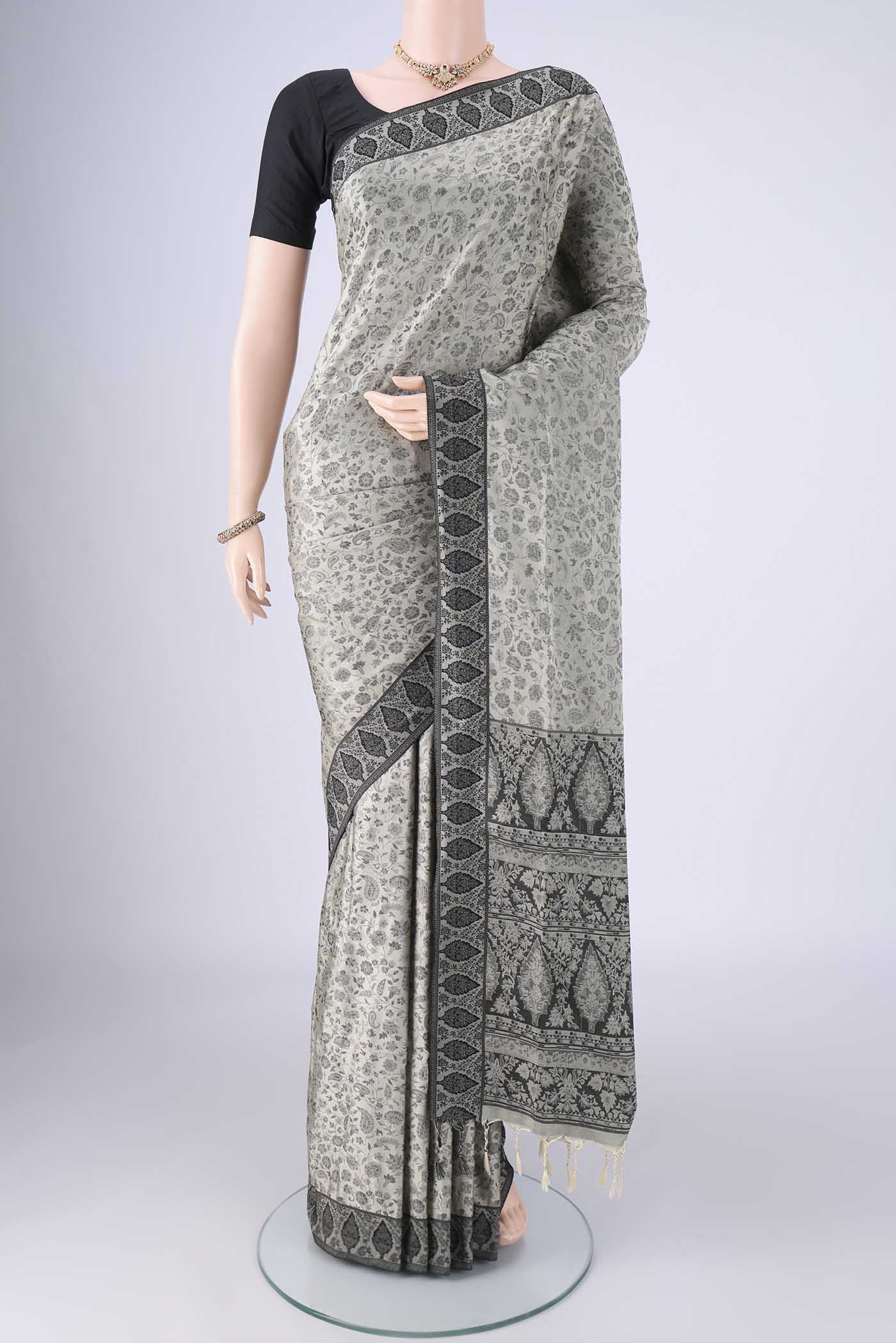 Davys Grey Soft Silk Saree with Jacquard design on the body and Thread Border.  displayed on a mannequin