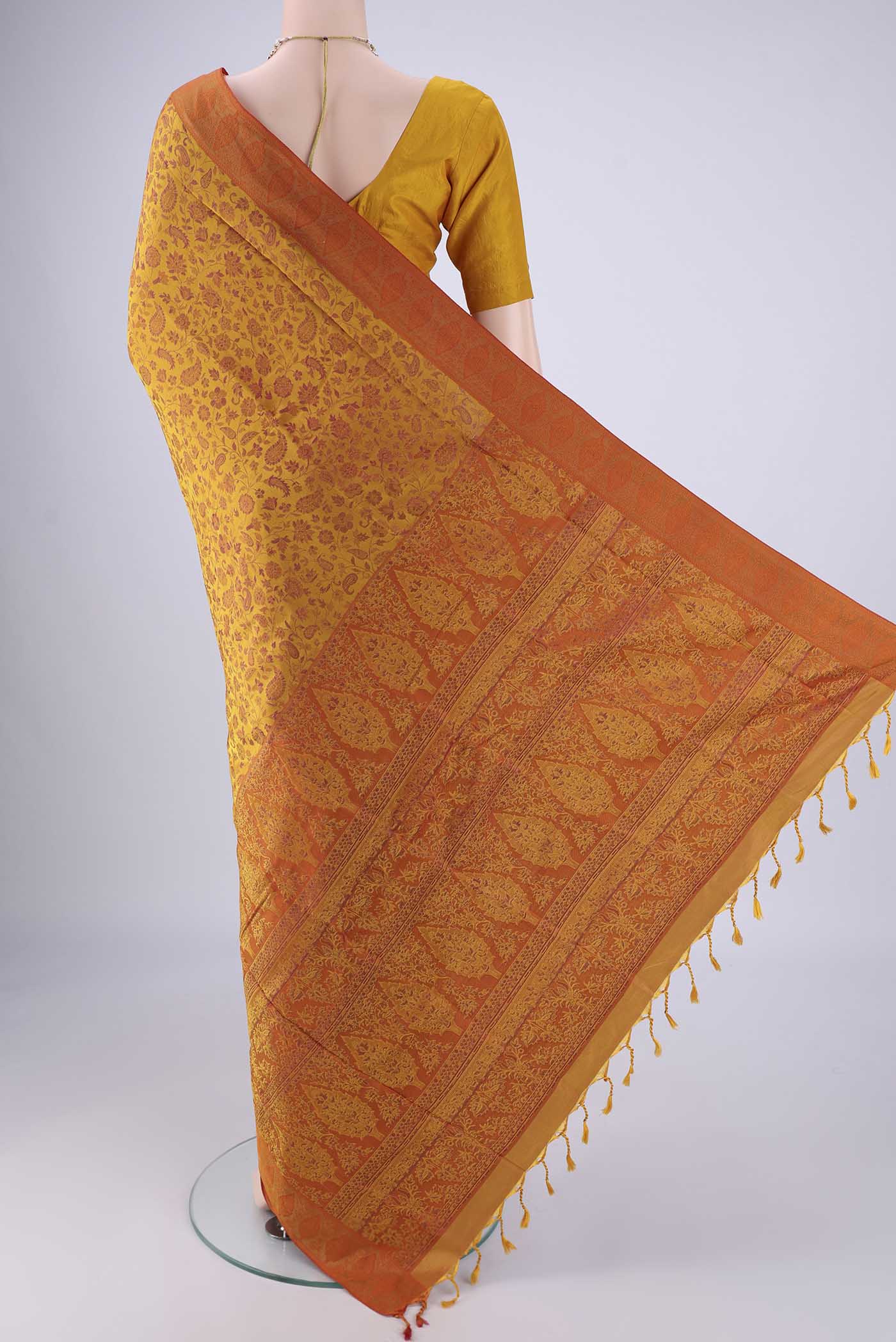 Flat view of Mustard Soft Silk Saree with Jacquard design on the body and Thread Border. 