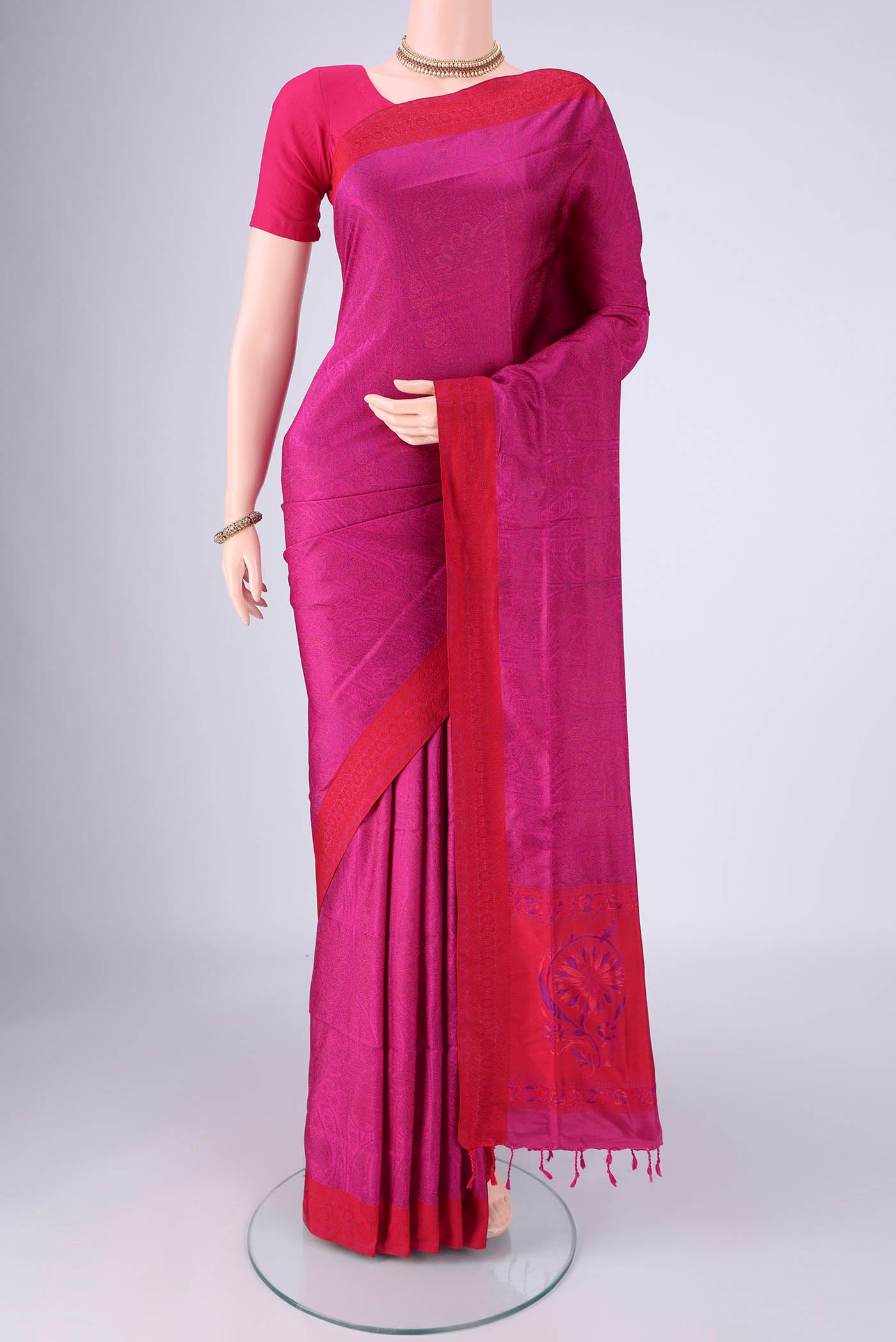 Rani Pink Soft Silk Saree with Jacquard design on the body and Thread Border.  displayed on a mannequin