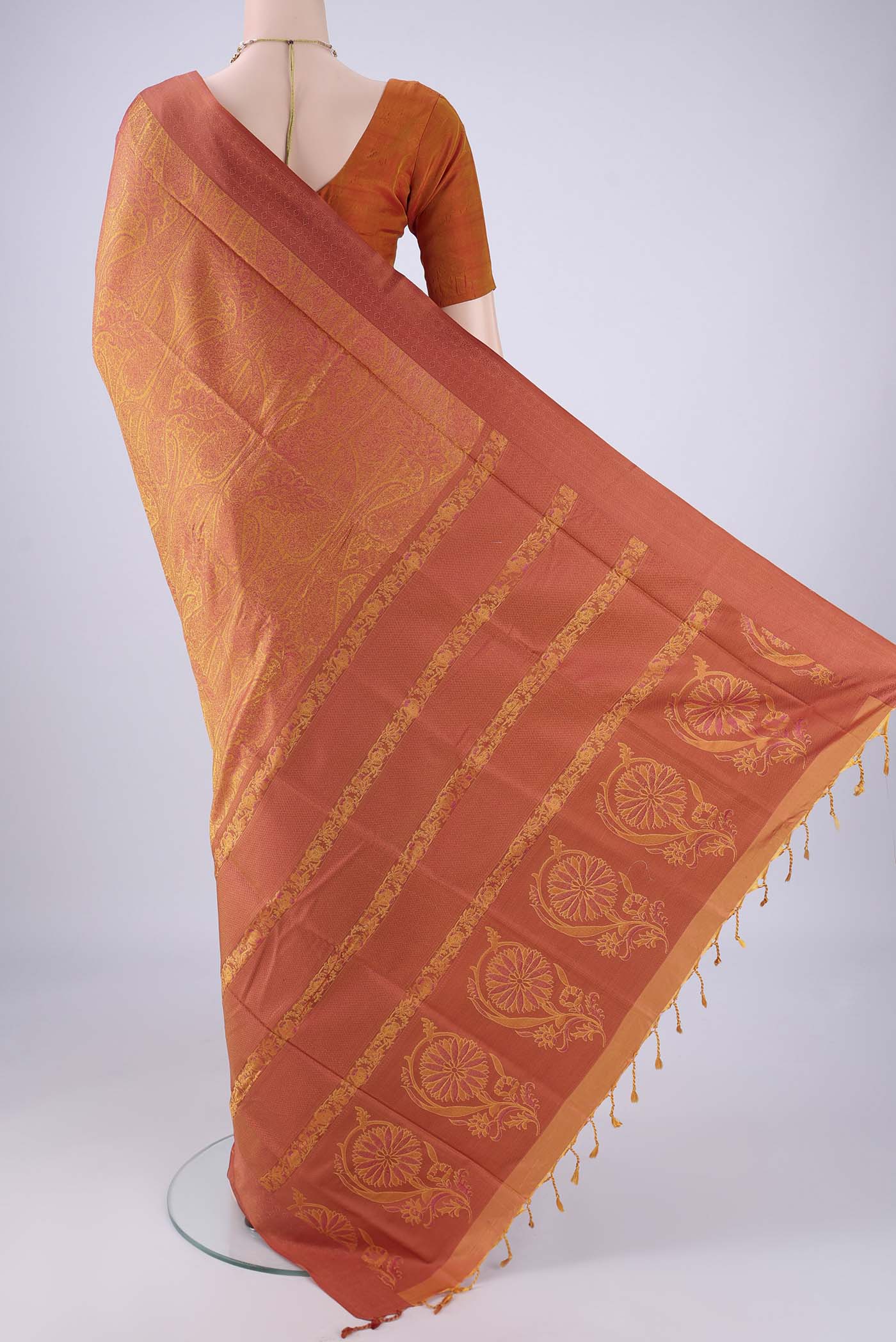 Flat view of Saffron Soft Silk Saree with Jacquard design on the body and Thread Border. 