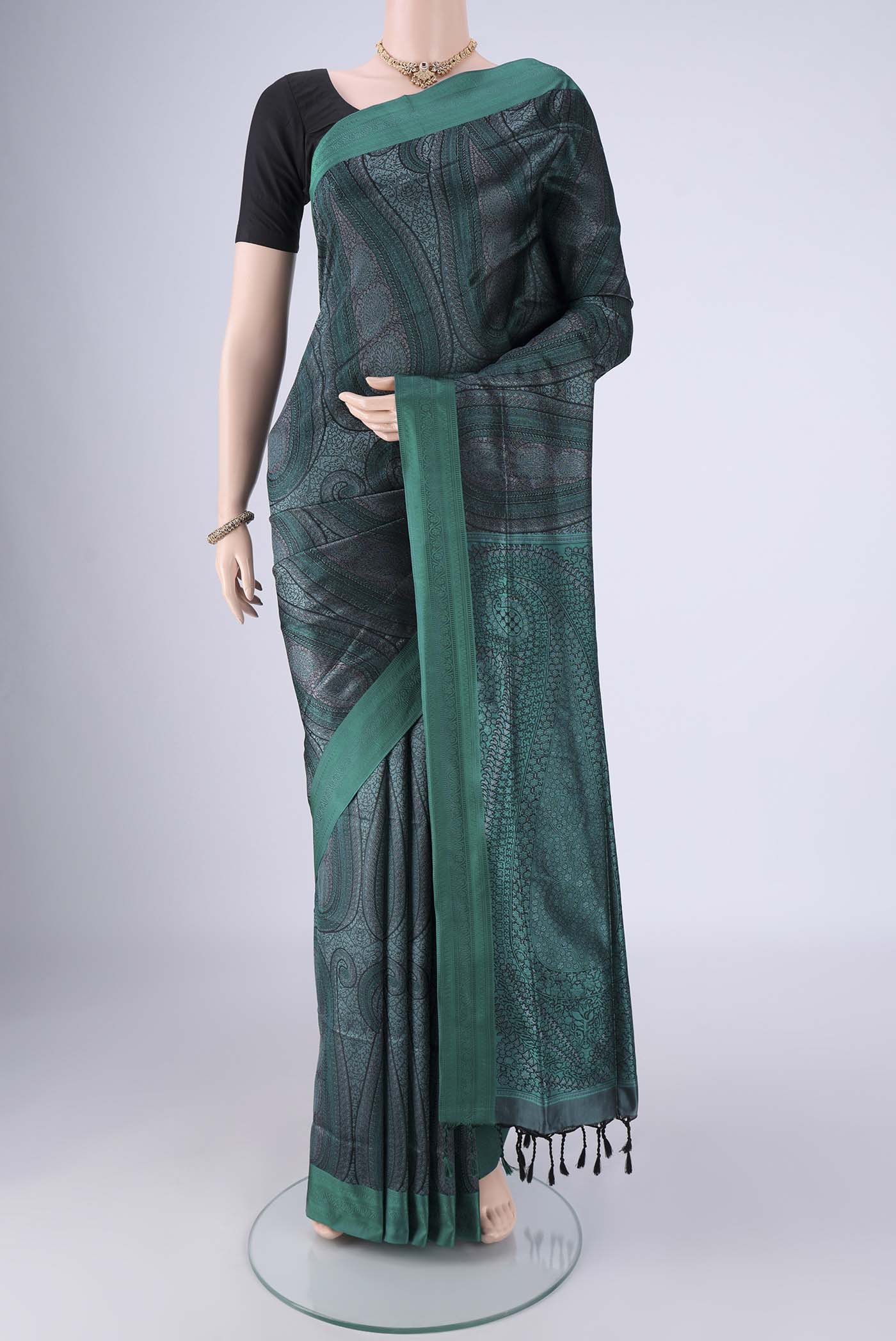 Bottle Green Soft Silk Saree with Jacquard design on the body and Thread Border.  displayed on a mannequin