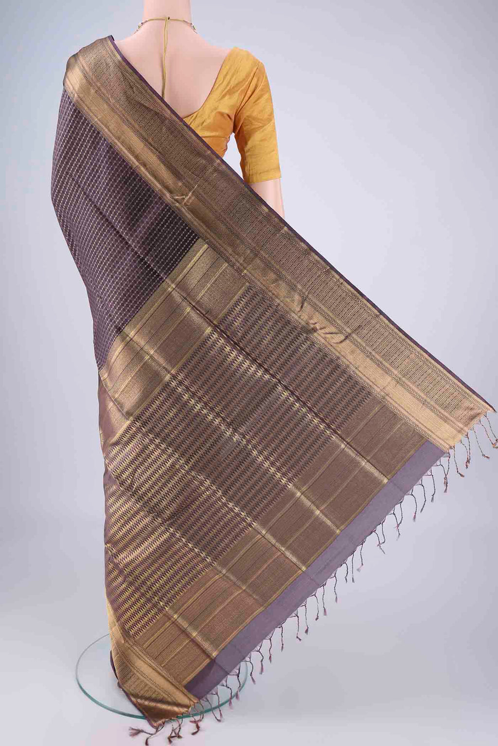 Flat view of Purple Soft Silk Saree with Jacquard With Zari Butta on the body and Zari Border. 
