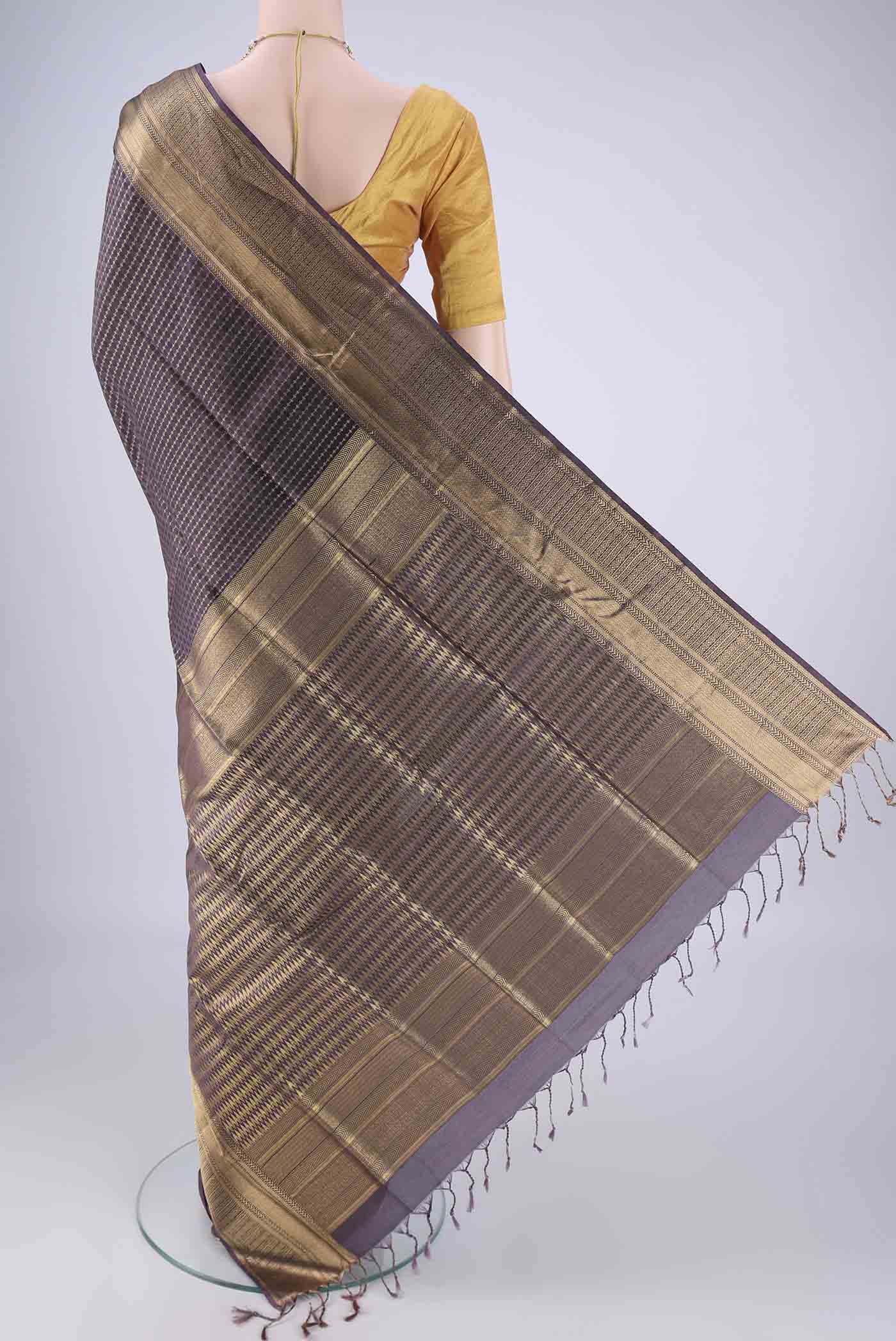 Flat view of Purple Soft Silk Saree with Jacquard With Zari Butta on the body and Zari Border. 