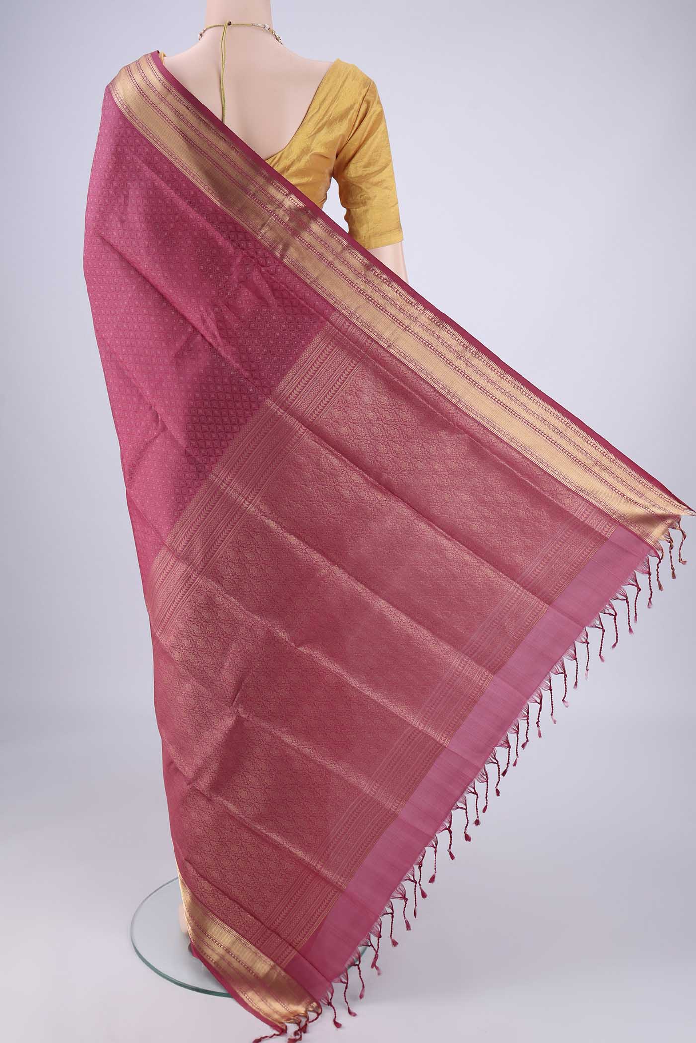 Flat view of Pink Soft Silk Saree with Jacquard With Zari Butta on the body and Zari Border. 