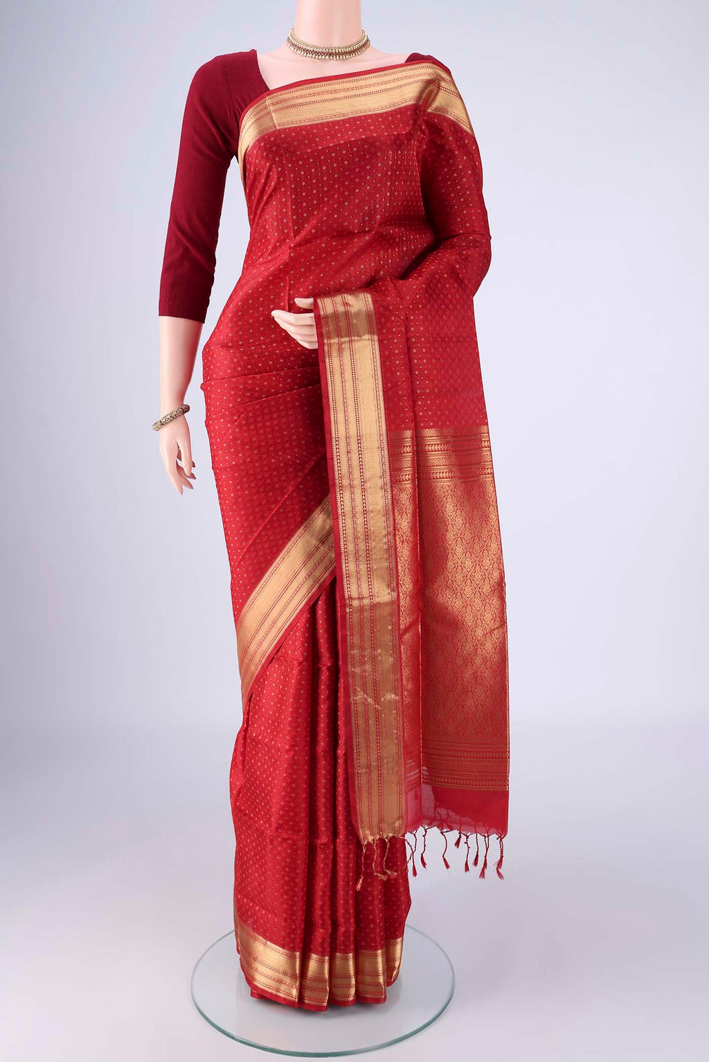 Deep Red Soft Silk Saree with Jacquard With Zari Butta on the body and Zari Border.  displayed on a mannequin