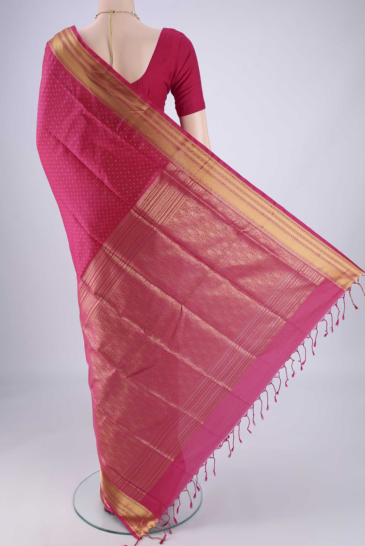 Flat view of Pink Soft Silk Saree with Jacquard With Zari Butta on the body and Zari Border. 
