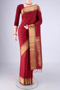 Maroon Soft Silk Saree with Jacquard With Zari Butta on the body and Zari Border.  displayed on a mannequin