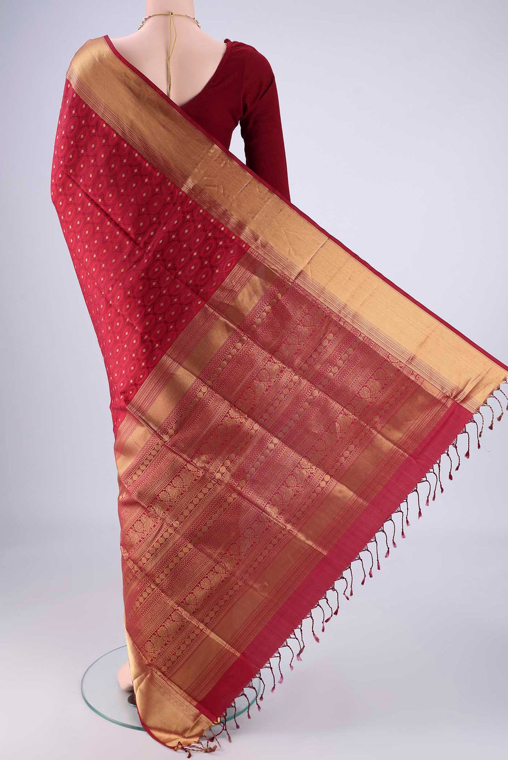 Flat view of Maroon Soft Silk Saree with Jacquard With Zari Butta on the body and Zari Border. 