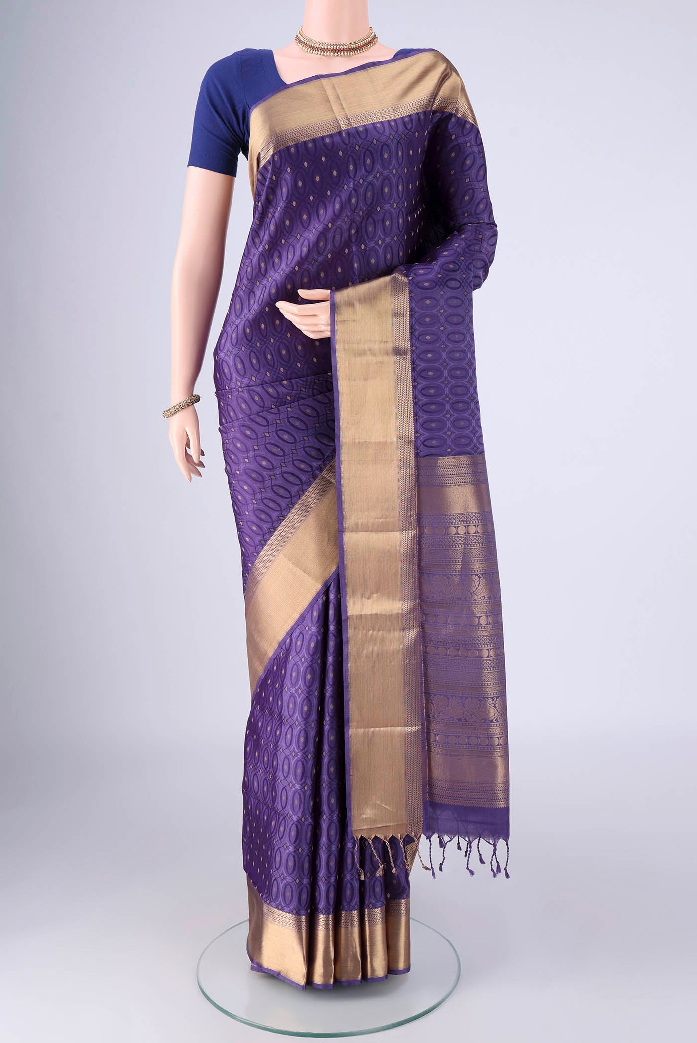 Violet Soft Silk Saree with Jacquard With Zari Butta on the body and Zari Border.  displayed on a mannequin
