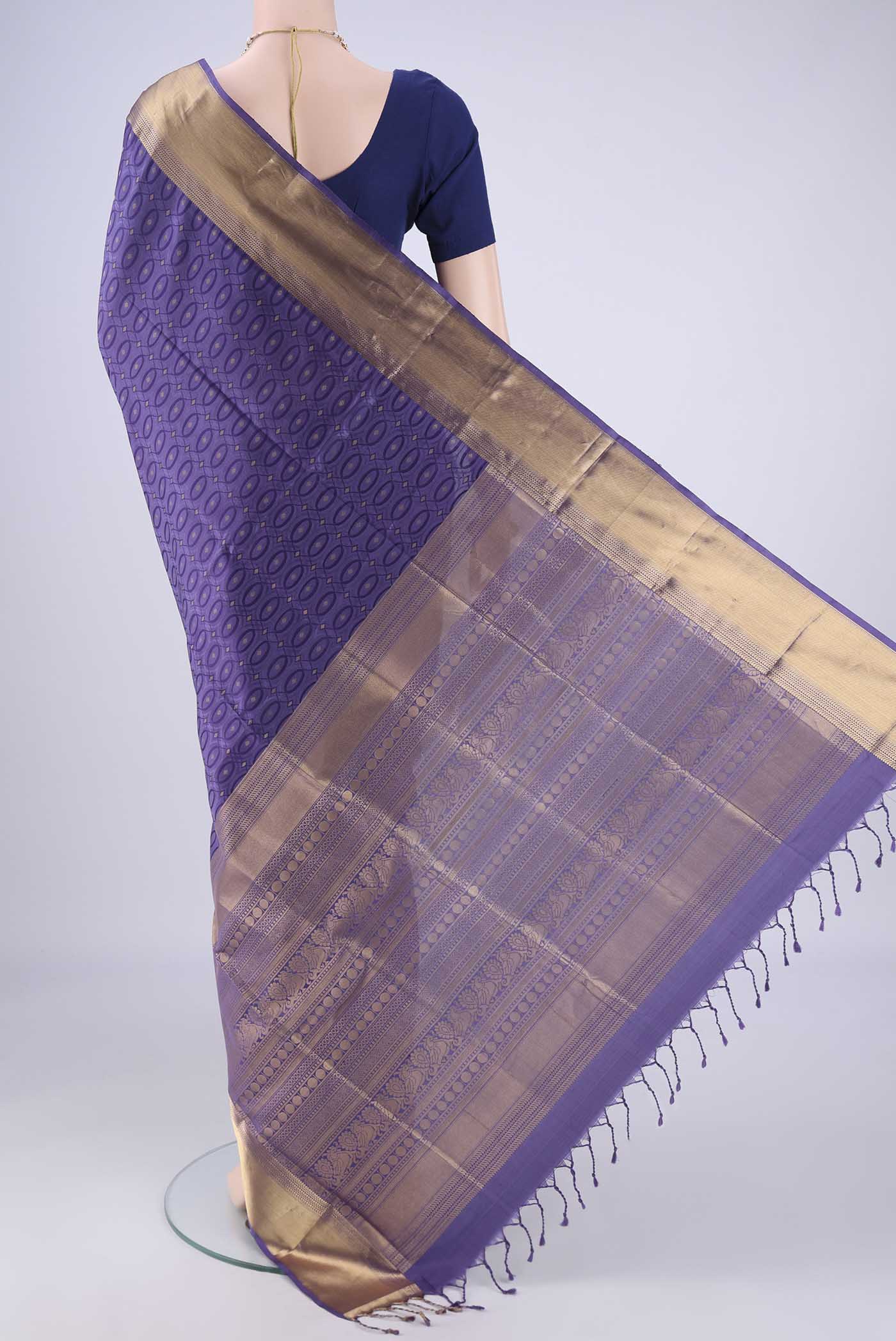 Flat view of Violet Soft Silk Saree with Jacquard With Zari Butta on the body and Zari Border. 