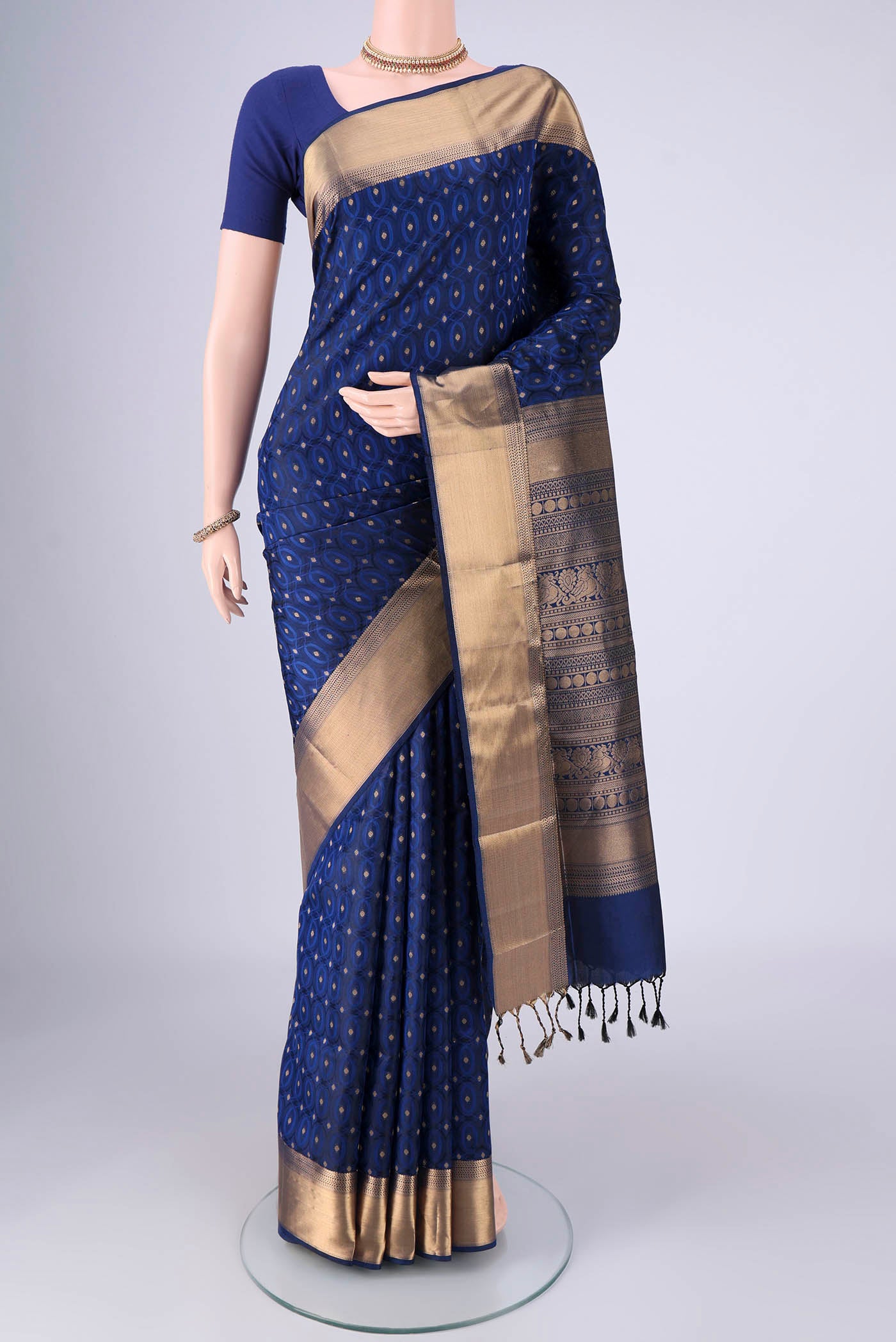 Dark Blue Soft Silk Saree with Jacquard With Zari Butta on the body and Zari Border.  displayed on a mannequin