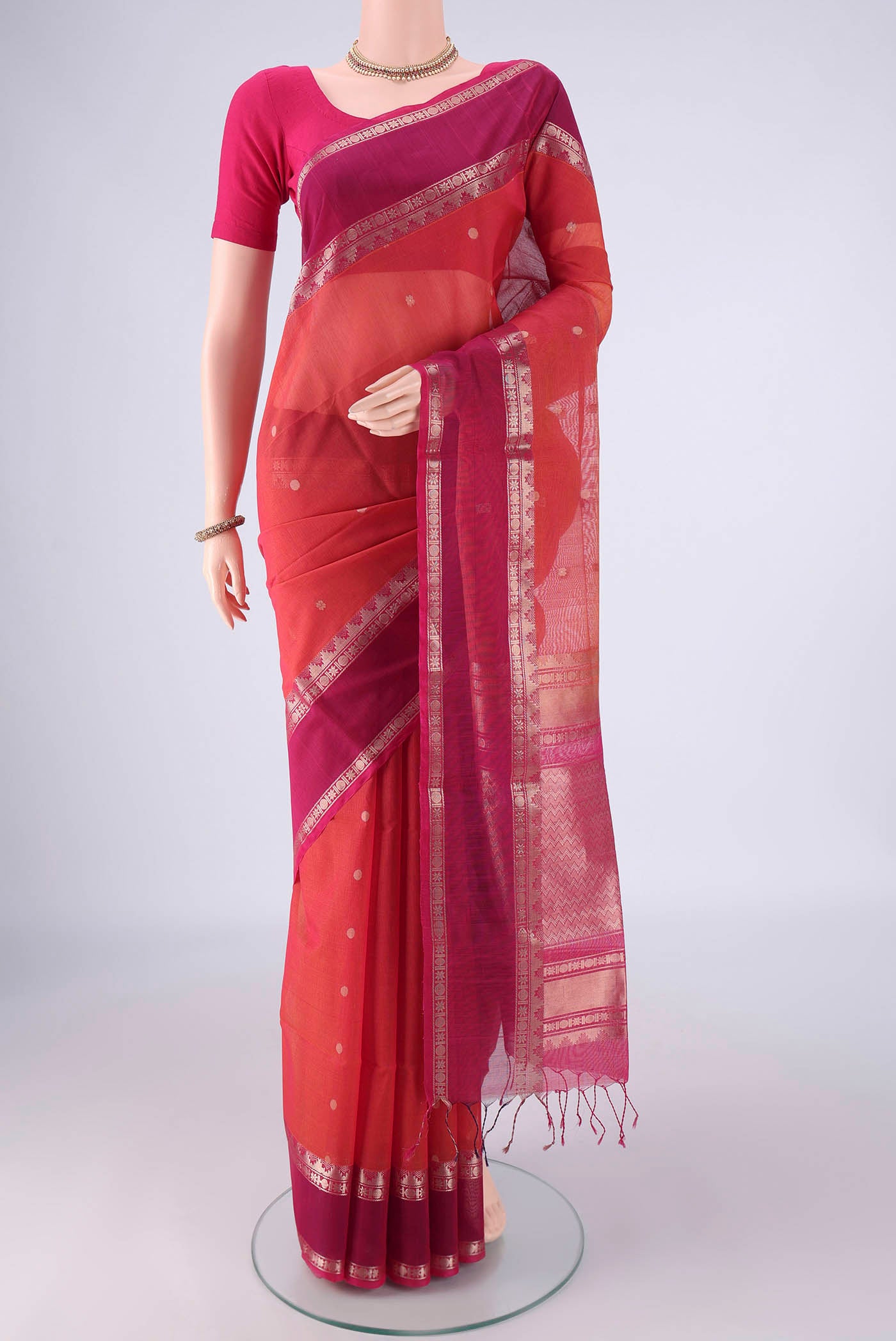 Dark Pink Kora Cotton Saree with Zari Butta on the body and Zari Border.  displayed on a mannequin