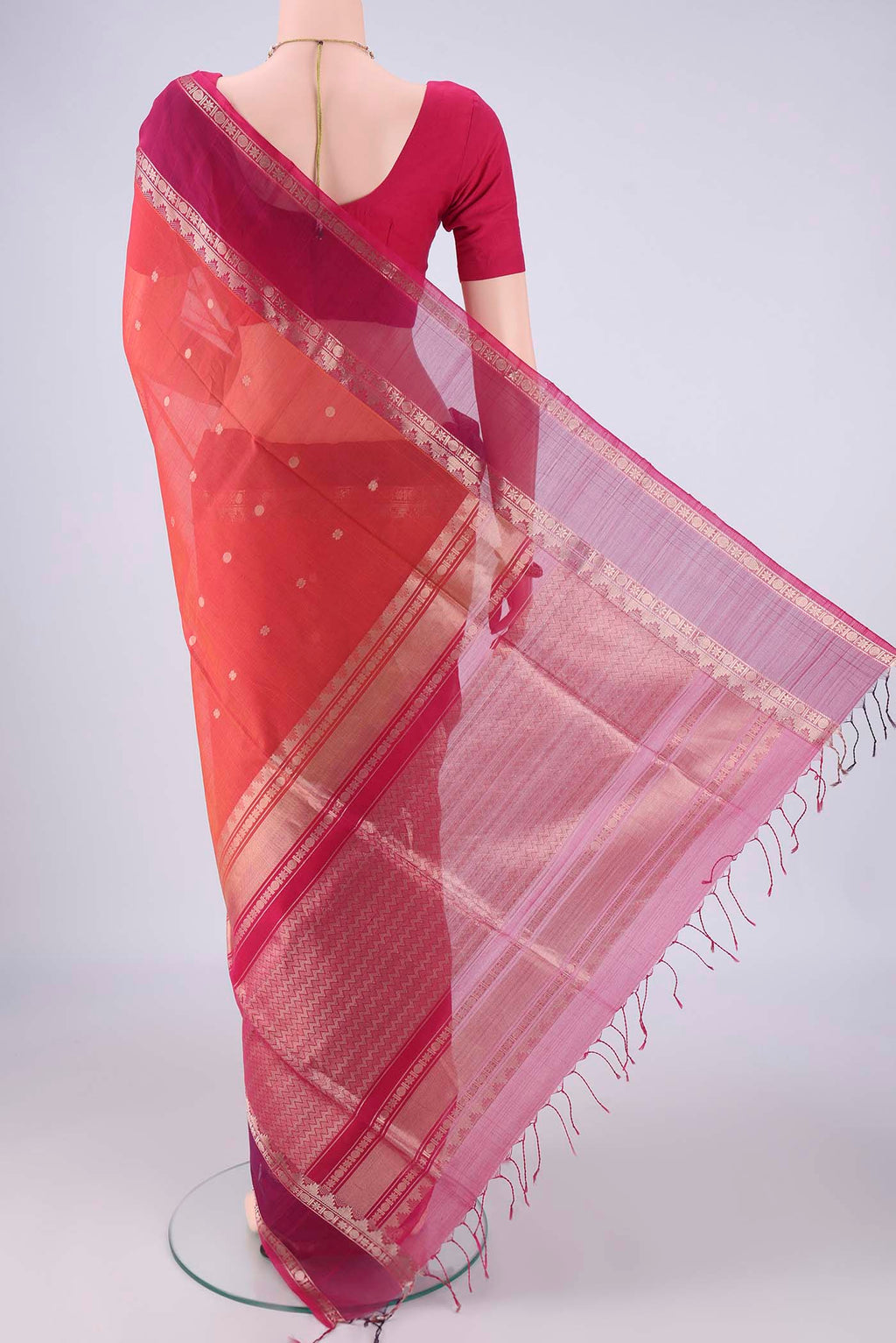 Flat view of Dark Pink Kora Cotton Saree with Zari Butta on the body and Zari Border. 