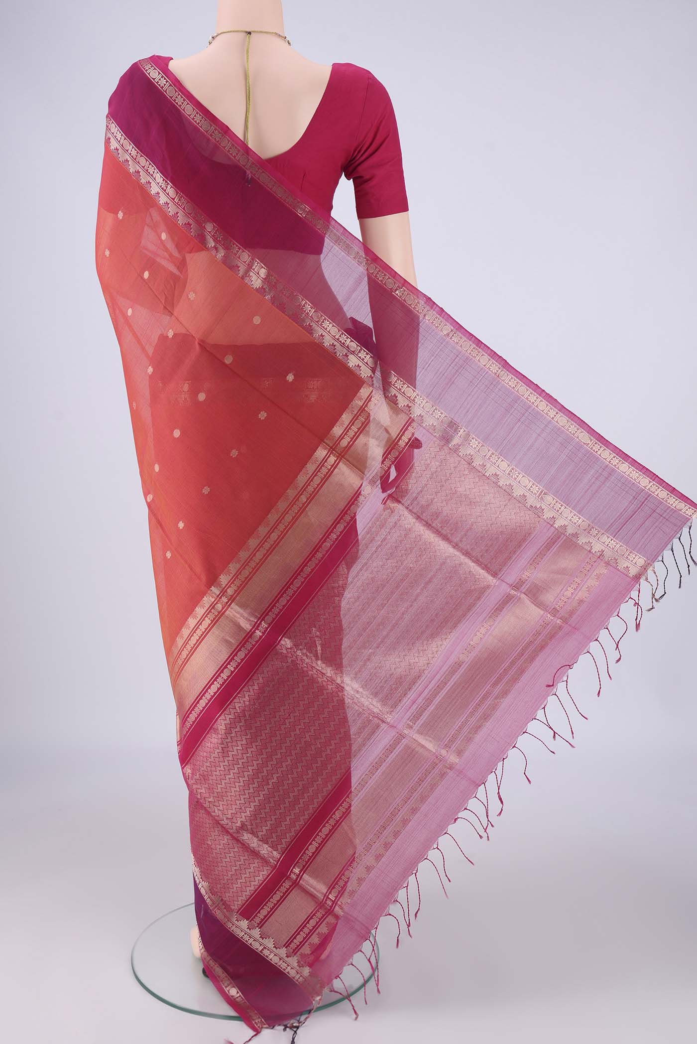 Flat view of Dark Pink Kora Cotton Saree with Zari Butta on the body and Zari Border. 