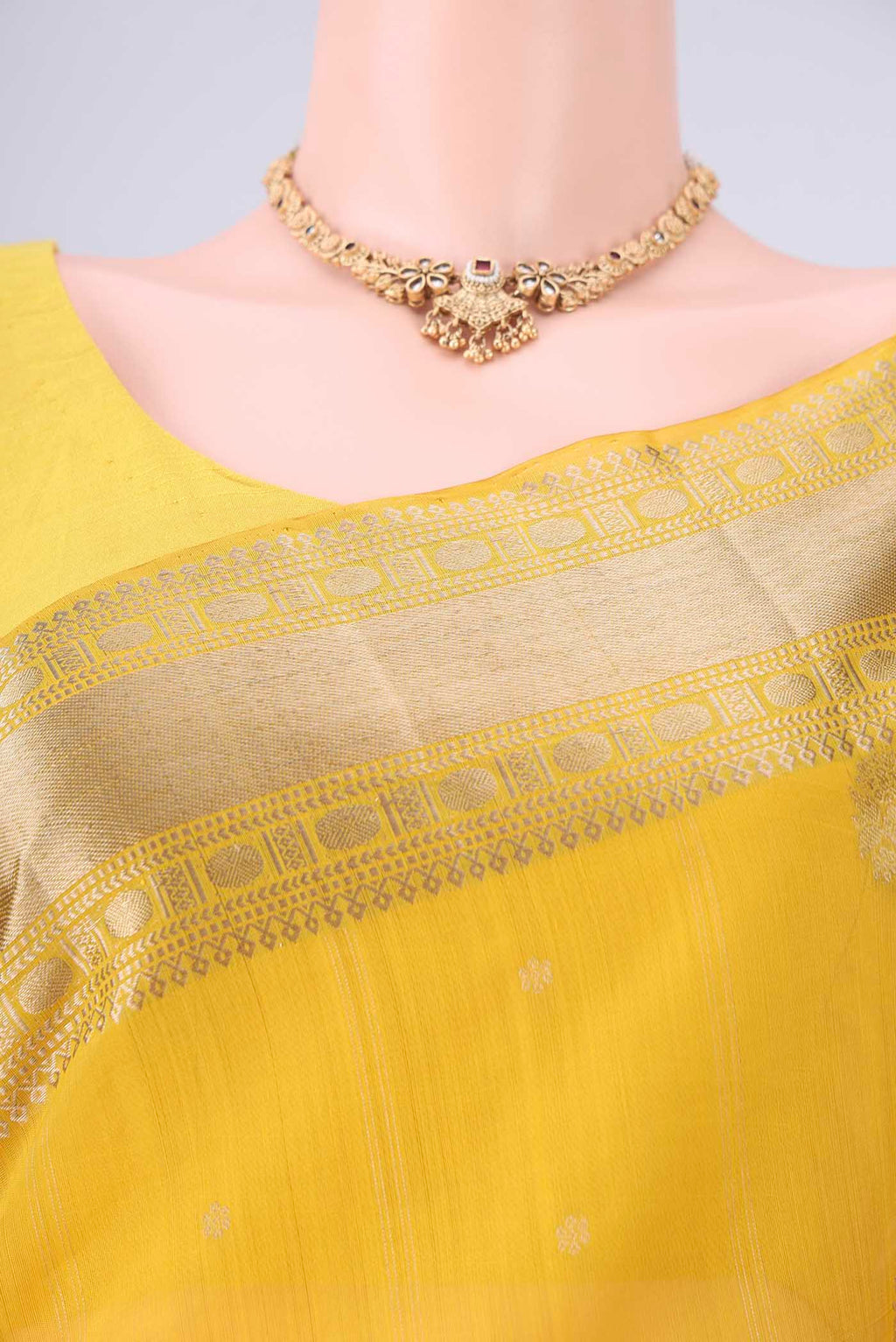 Border image of Yellow Kora Cotton Saree with Zari Butta on the body and Zari Border. 