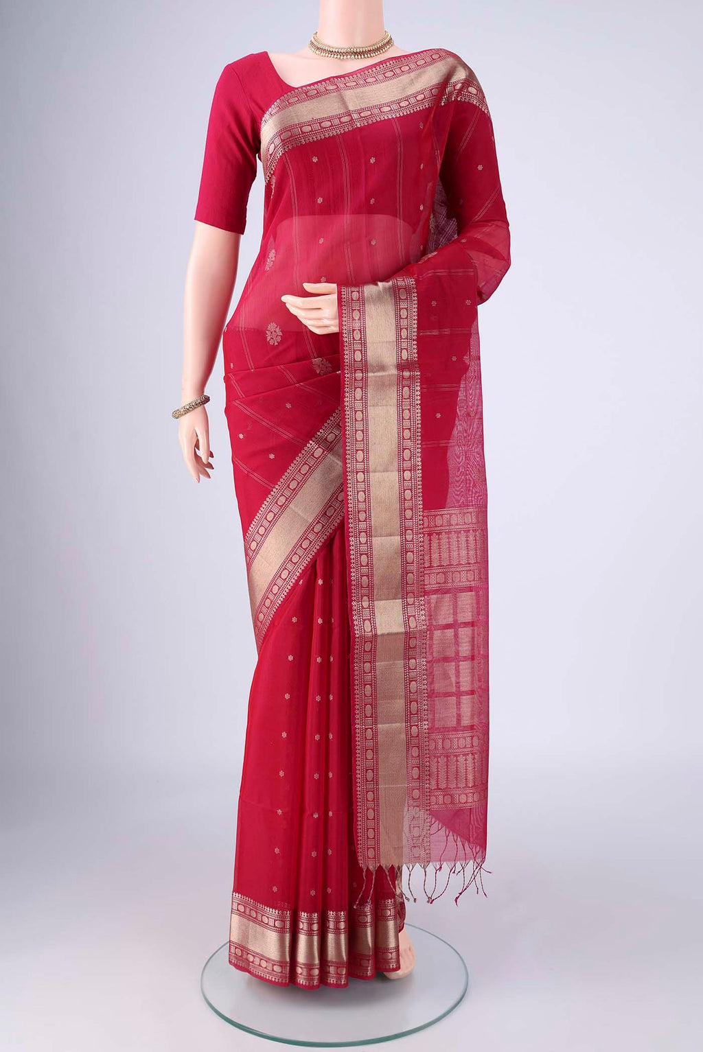 Dark Pink Silk Cotton Saree with Zari Butta on the body and Zari Border.  displayed on a mannequin