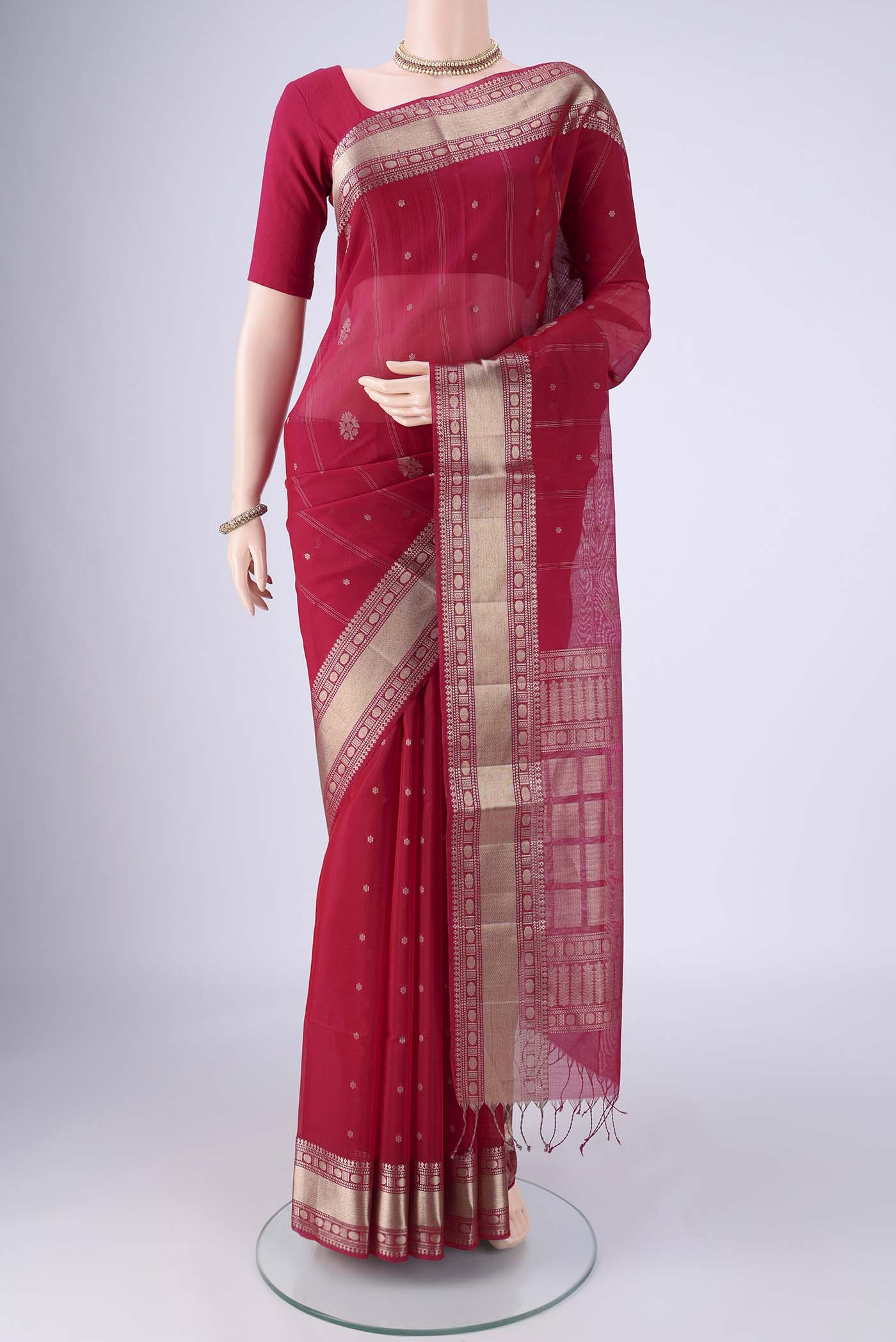 Dark Pink Silk Cotton Saree with Zari Butta on the body and Zari Border.  displayed on a mannequin