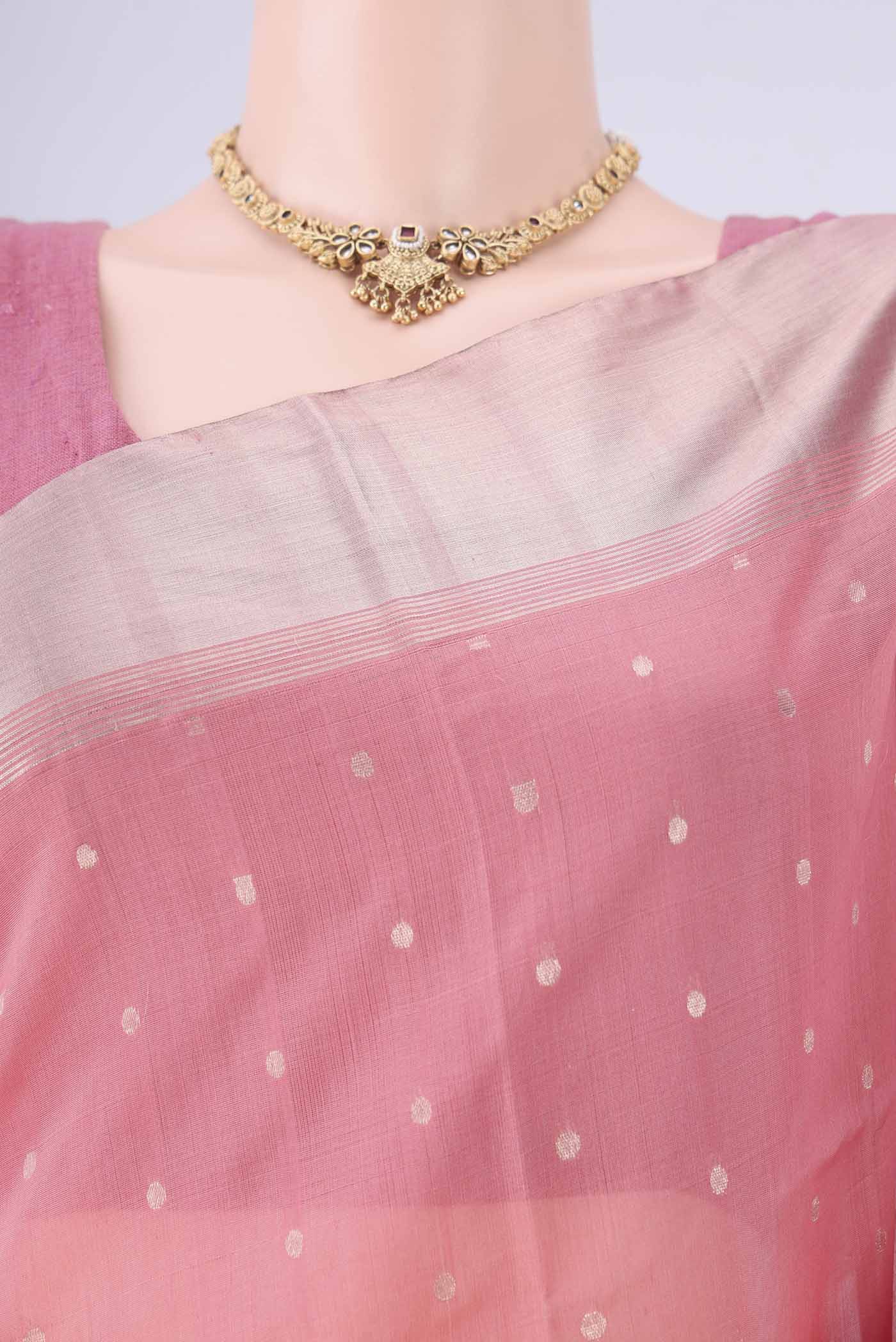 Border image of Peach Kora Cotton Saree with Zari Butta on the body and Zari Border. 