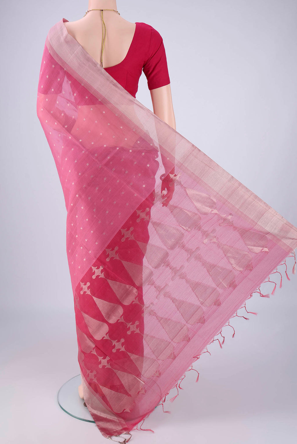 Flat view of Rose pink Silk Cotton Saree with Zari Butta on the body and Zari Border. 