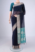 Navy Blue Silk Cotton Saree with Zari Butta on the body and Zari Border.  displayed on a mannequin