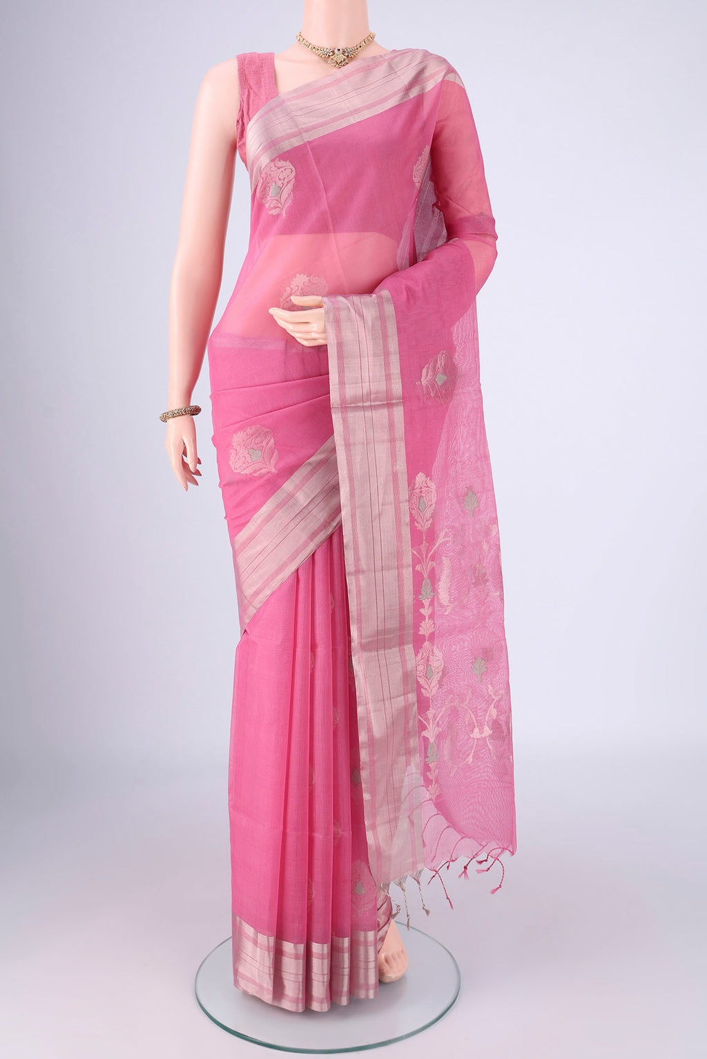 Pink Silk Cotton Saree with Zari Butta on the body and Zari Border.  displayed on a mannequin
