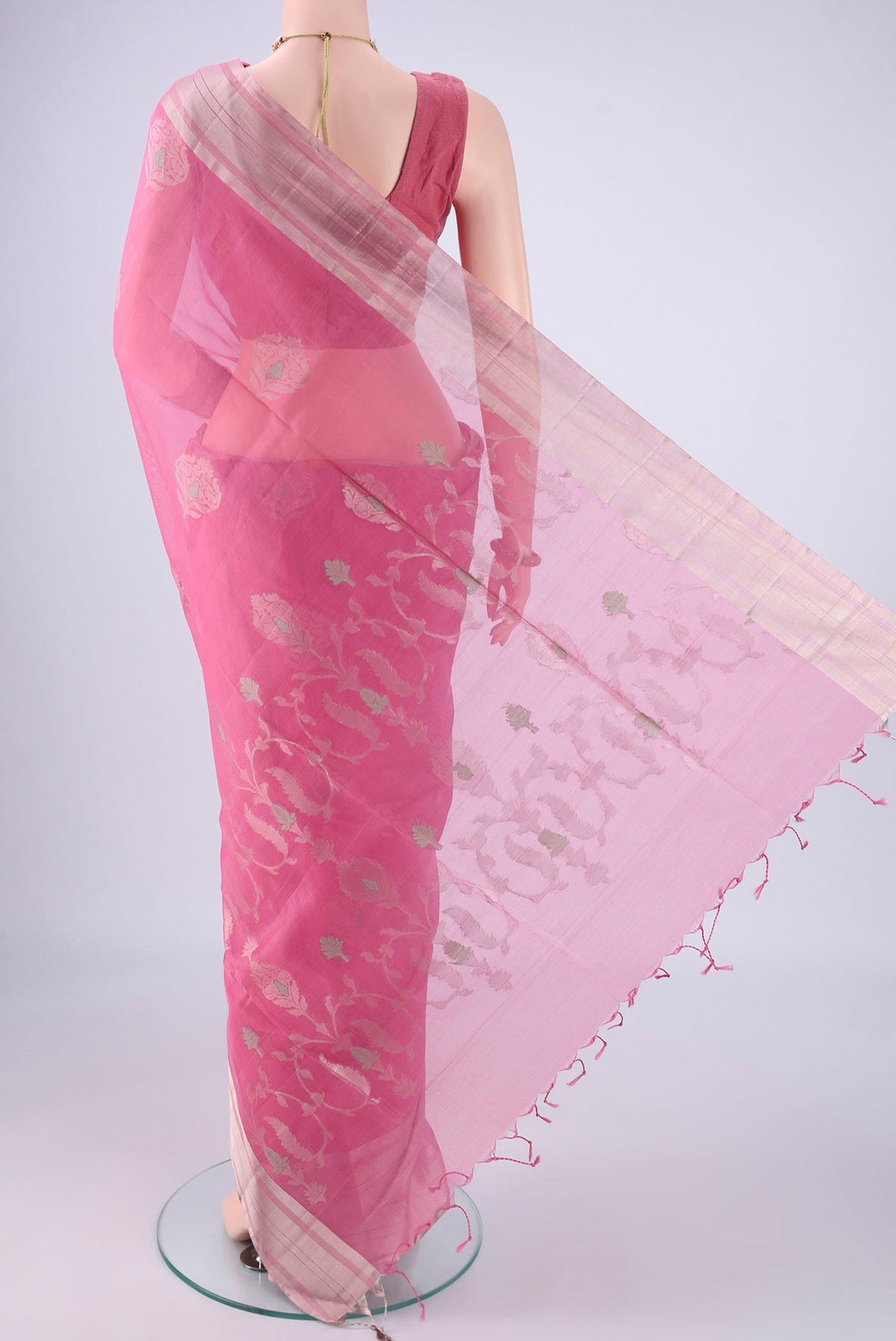 Flat view of Pink Silk Cotton Saree with Zari Butta on the body and Zari Border. 