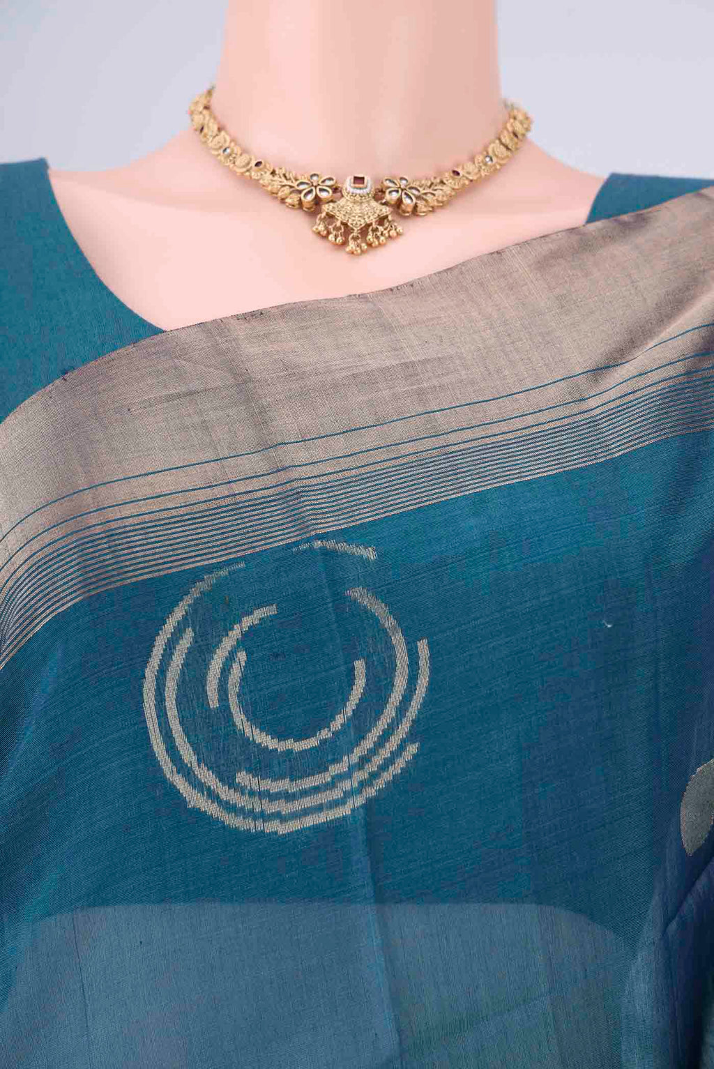 Border image of Peacock Blue Kora Cotton Saree with Zari Butta on the body and Zari Border. 