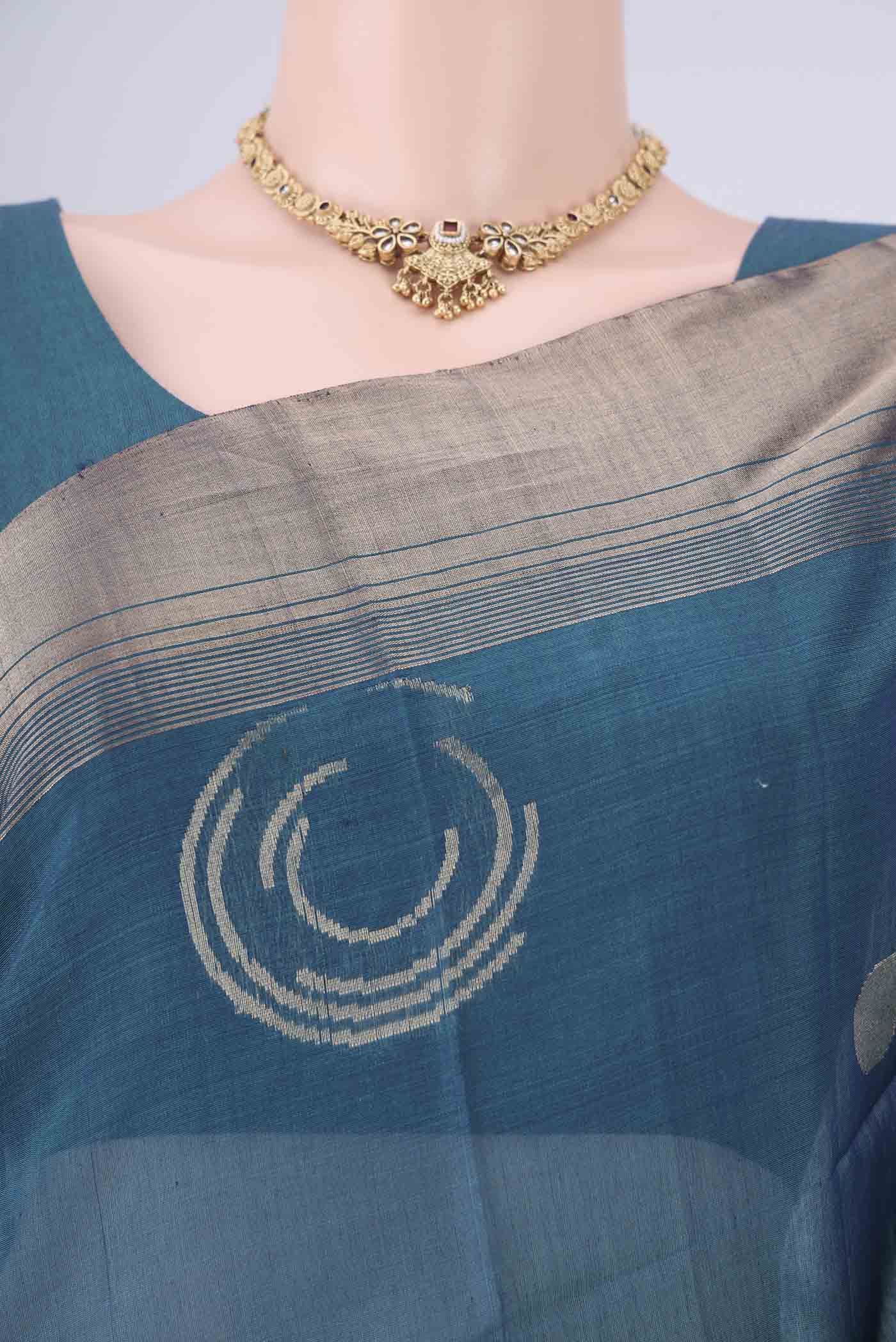Border image of Peacock Blue Kora Cotton Saree with Zari Butta on the body and Zari Border. 