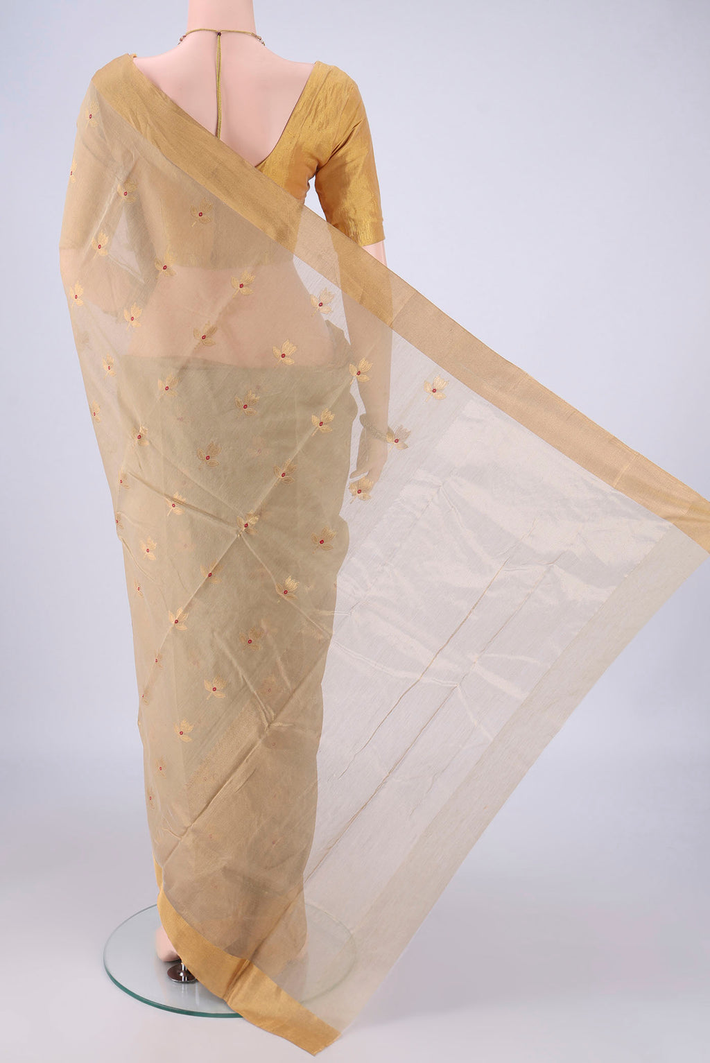 Flat view of Beige Chanderi Silk Cotton Saree with Zari And Thread Butta on the body and Zari Border. 