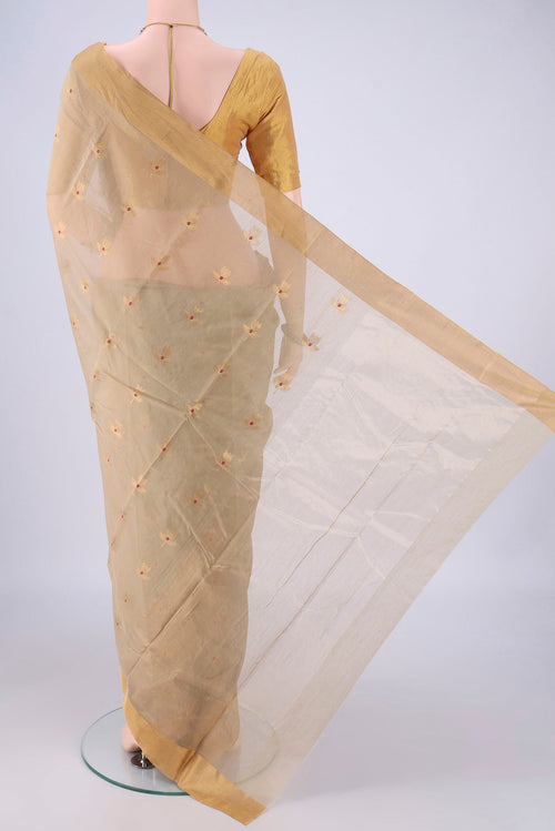 Flat view of Beige Chanderi Silk Cotton Saree with Zari And Thread Butta on the body and Zari Border. 