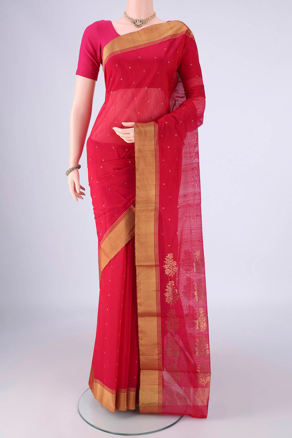 Dark Pink Chanderi Silk Cotton Saree with Zari Butta on the body and Zari Border.  displayed on a mannequin