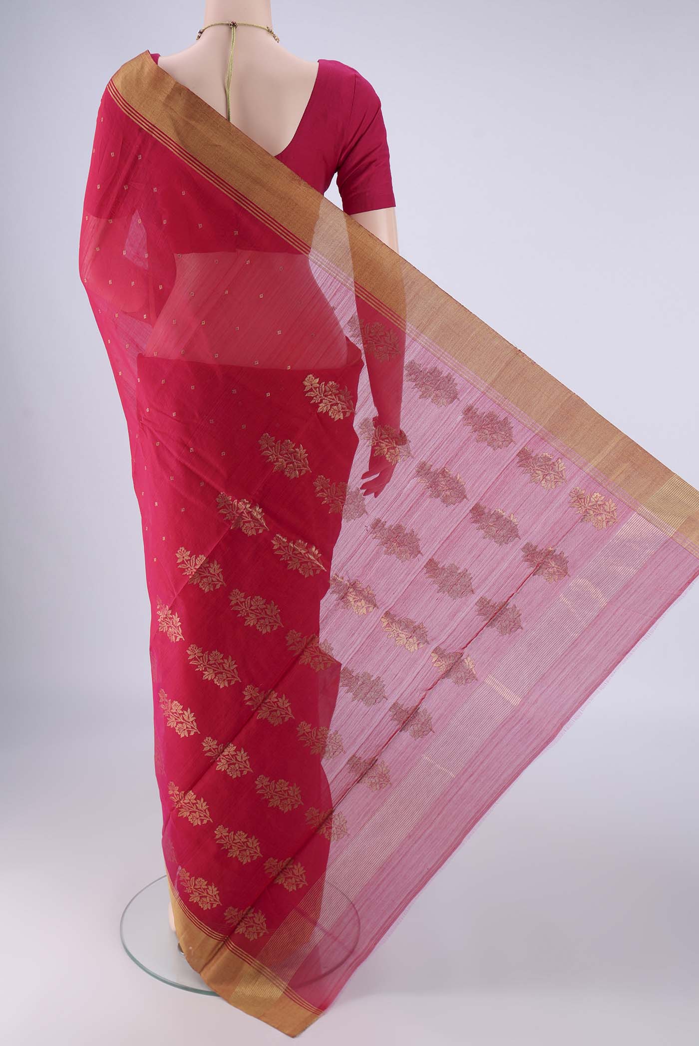Flat view of Dark Pink Chanderi Silk Cotton Saree with Zari Butta on the body and Zari Border. 