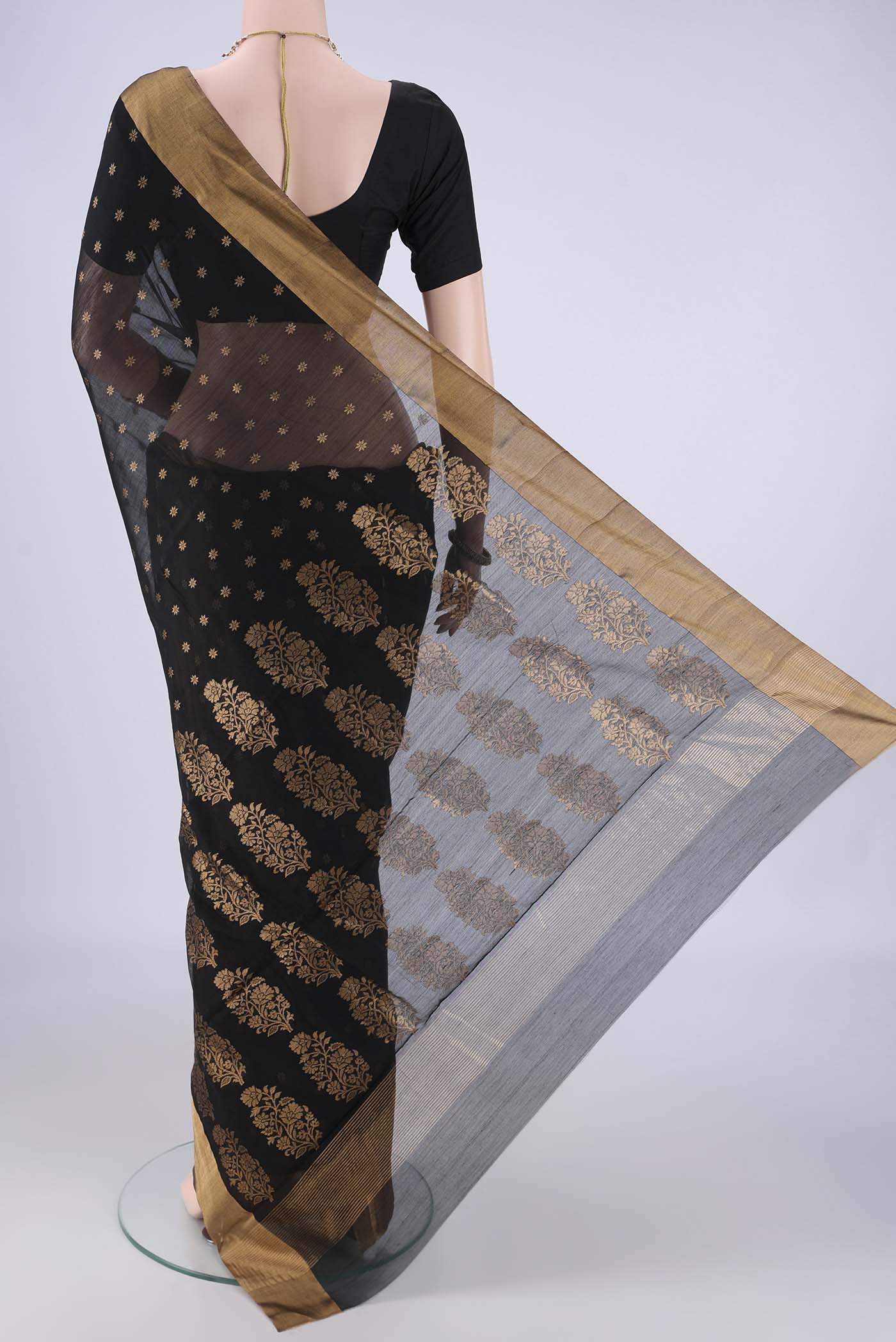 Flat view of Black Chanderi Silk Cotton Saree with Zari Butta on the body and Zari Border. 
