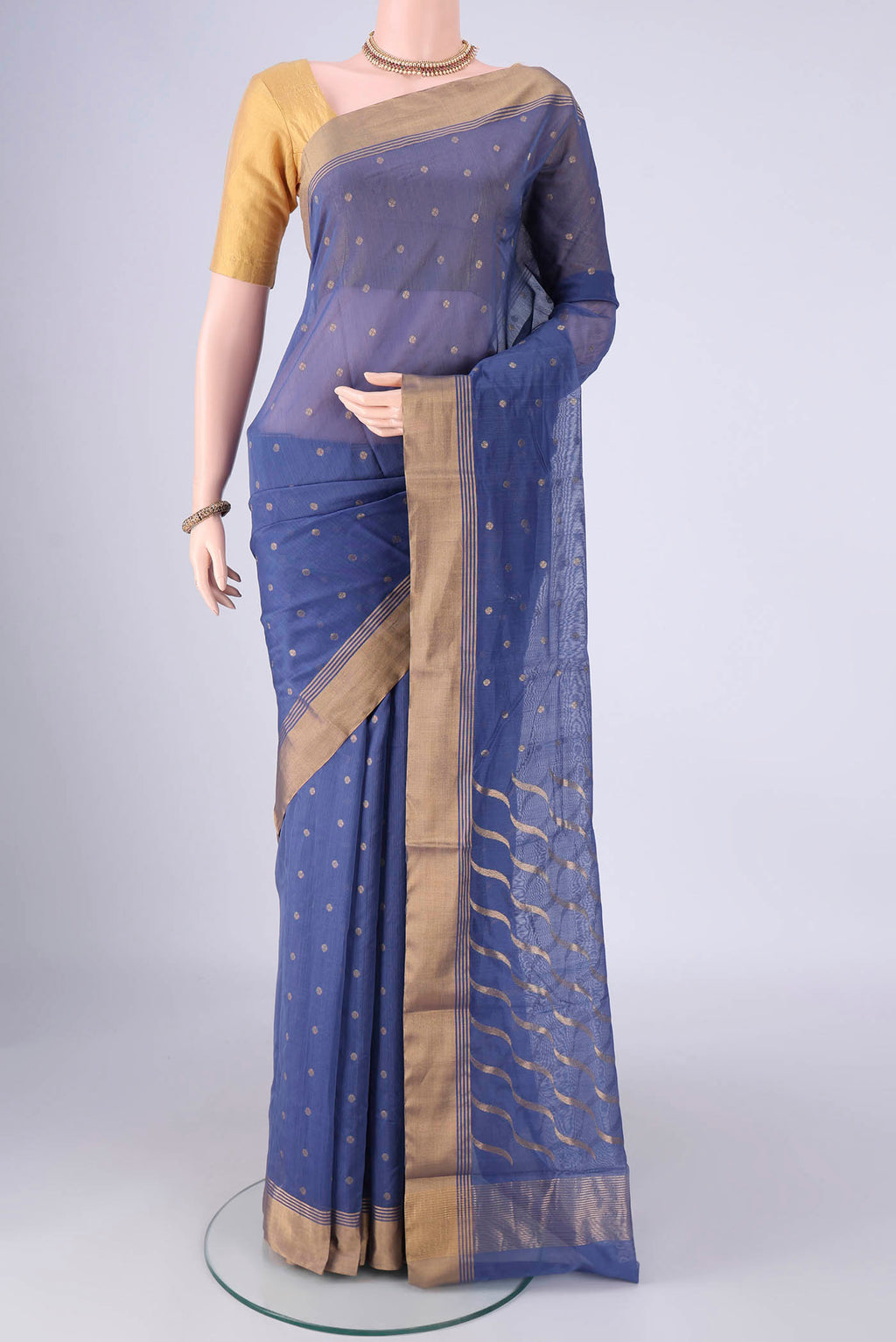 Maya Blue Chanderi Silk Cotton Saree with Zari Butta on the body and Zari Border.  displayed on a mannequin