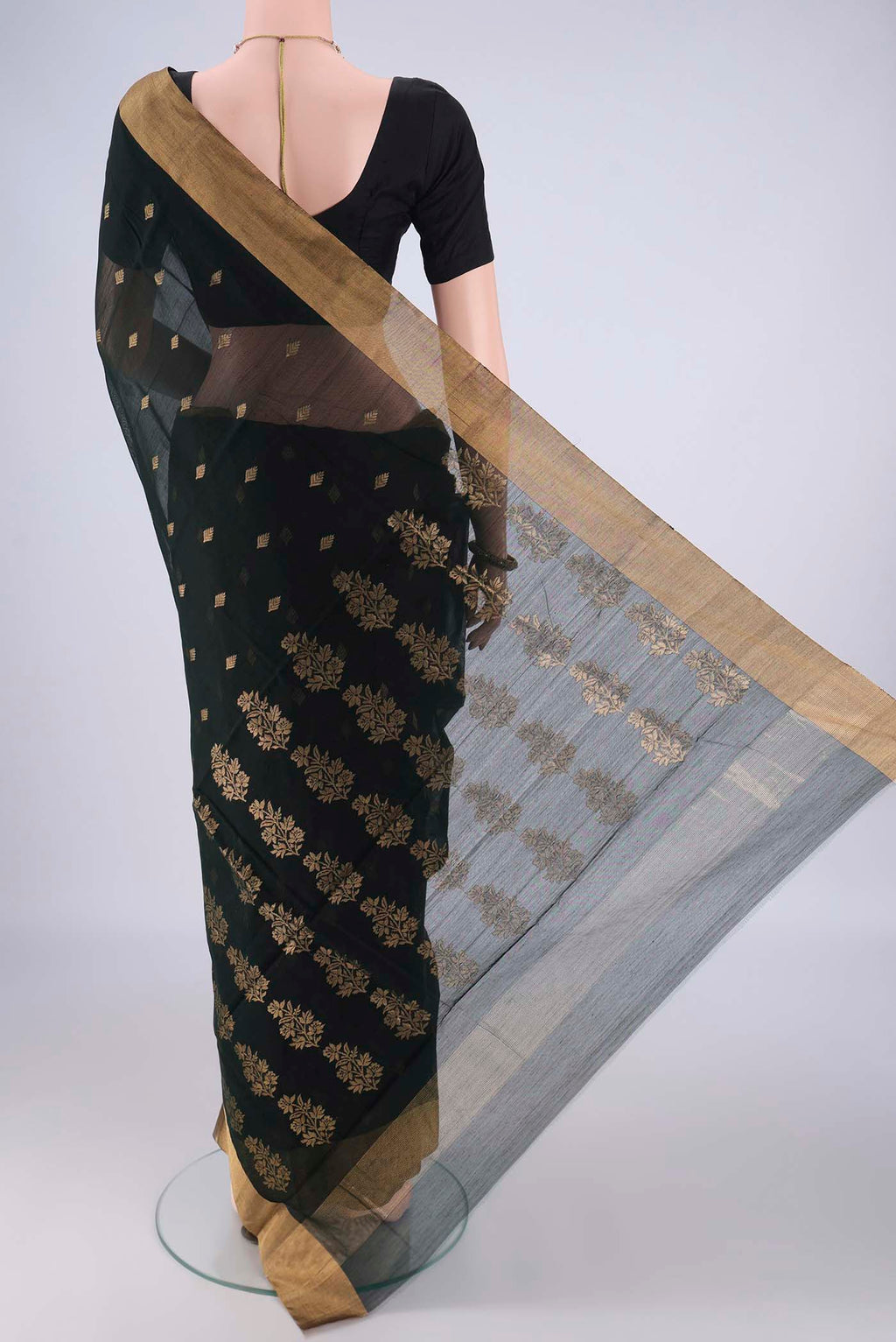 Flat view of Bottle Green Chanderi Silk Cotton Saree with Zari Butta on the body and Zari Border. 