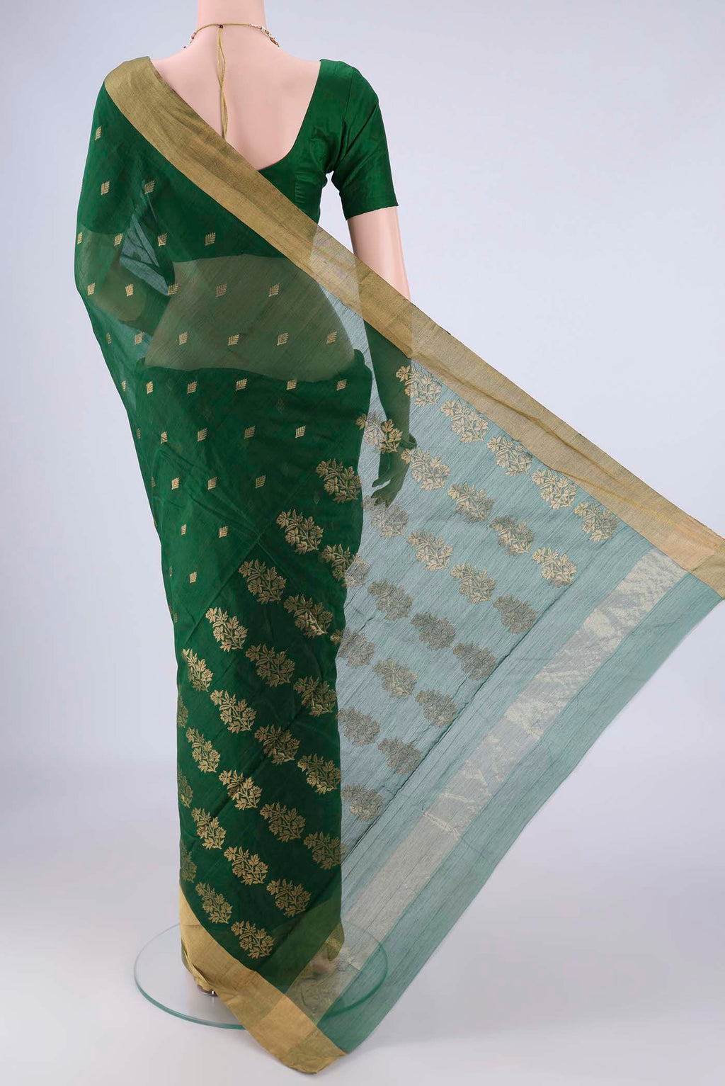 Flat view of Bottle Green Chanderi Silk Cotton Saree with Zari Butta on the body and Zari Border. 