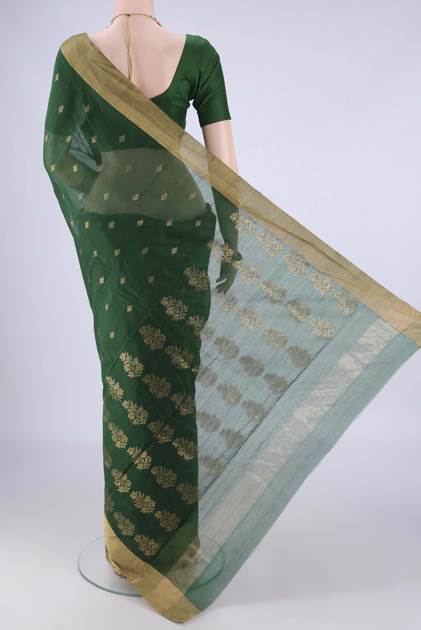 Flat view of Bottle Green Chanderi Silk Cotton Saree with Zari Butta on the body and Zari Border. 
