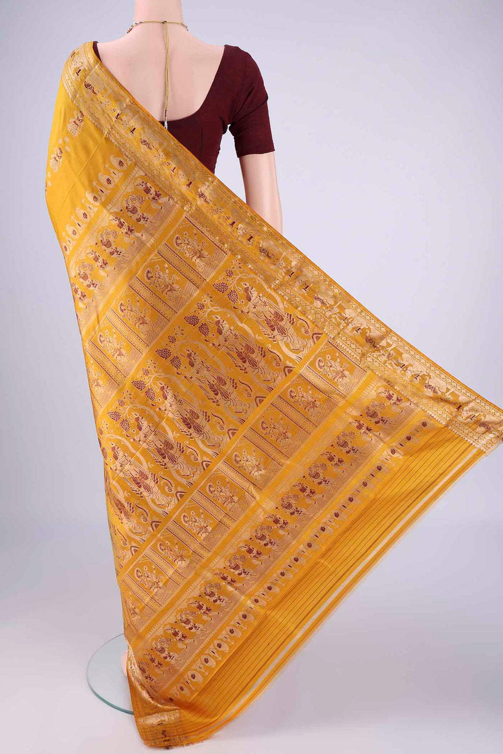 Flat view of Mustard Baluchari Silk Saree with Zari And Thread Butta on the body and Zari And Thread Border. 