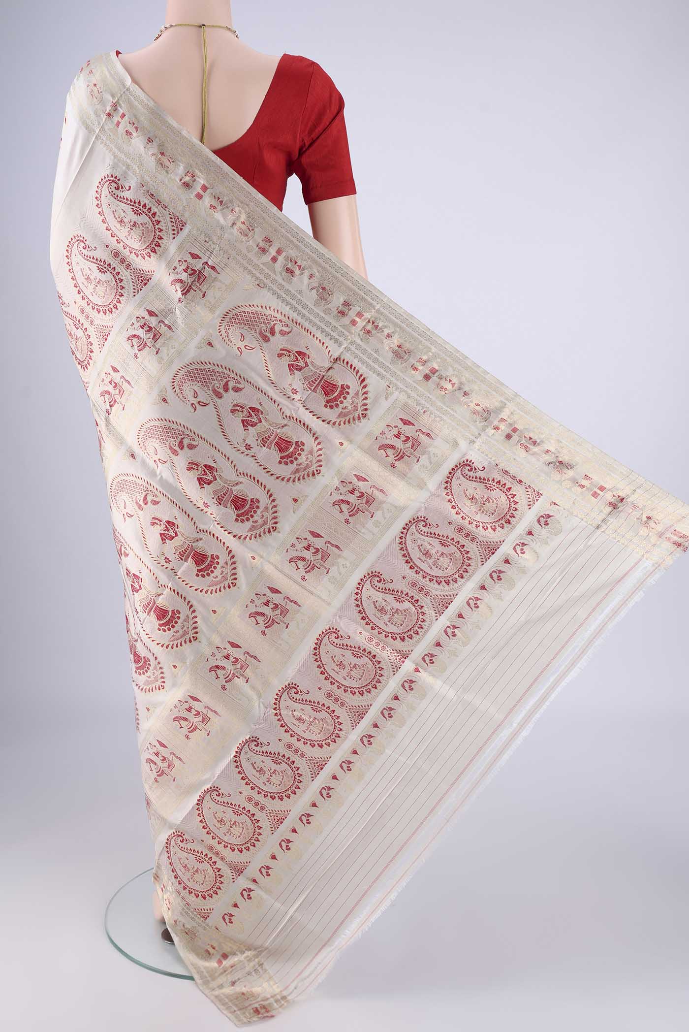Flat view of Beige Baluchari Silk Saree with Zari And Thread Butta on the body and Zari And Thread Border. 
